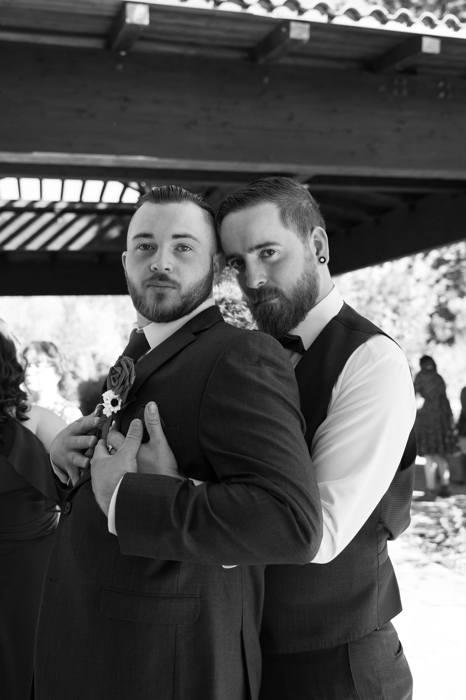 Intimate black and white wedding photo series showing tender moments between newlyweds.