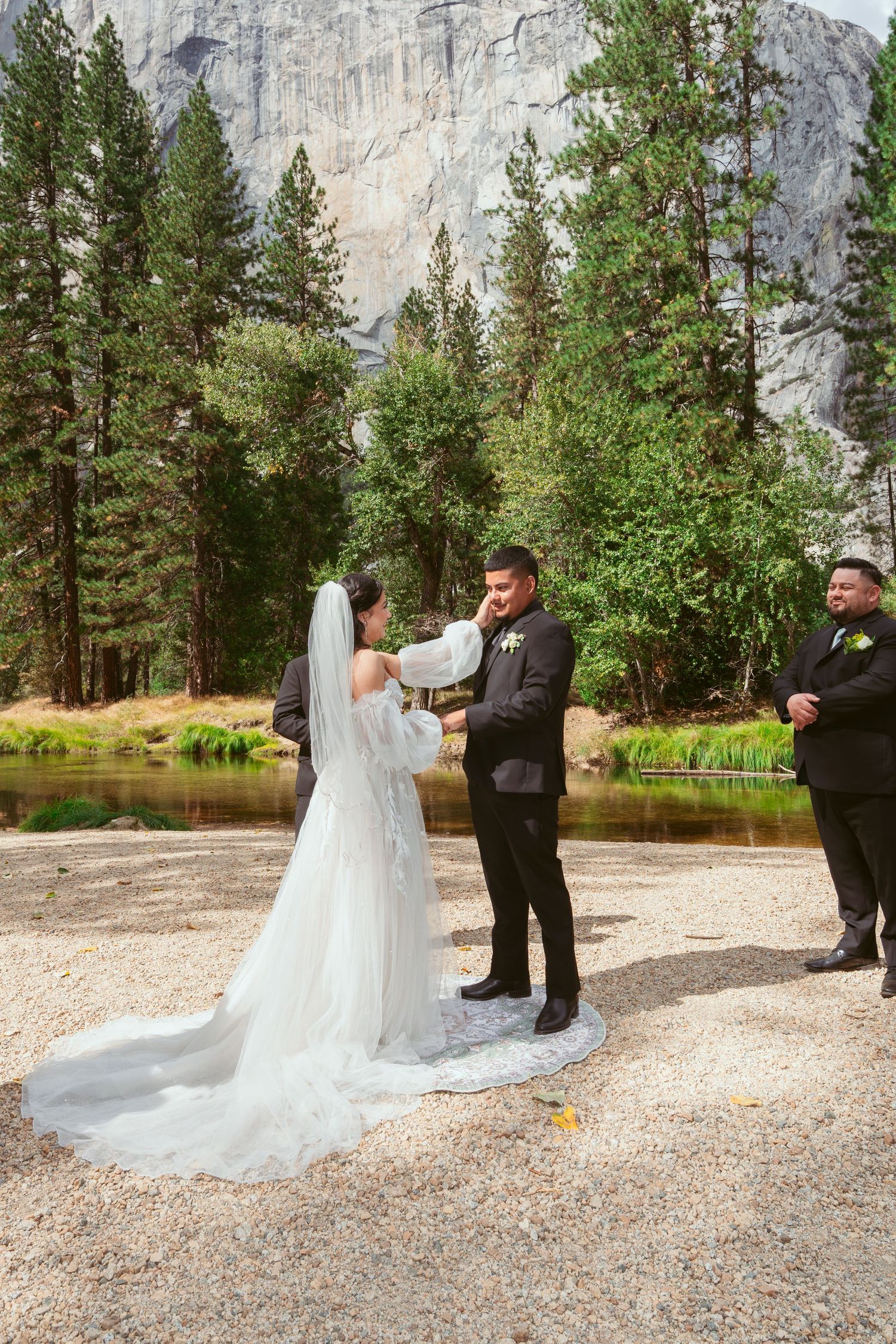 Wedding ceremony takes place against majestic granite cliffs of Yosemite National Park.