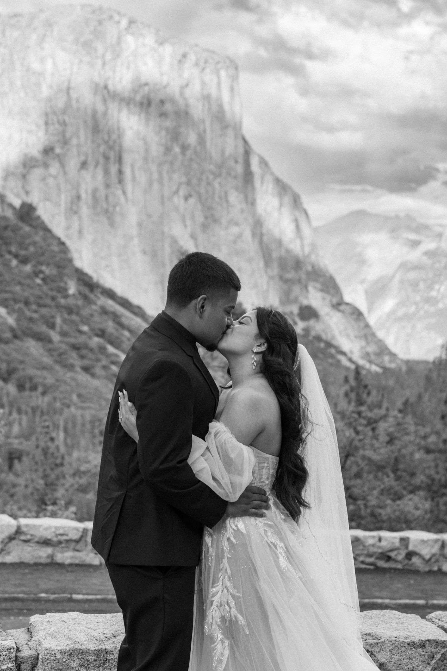Intimate wedding portraits captured against the towering El Capitan cliff face in Yosemite National Park.