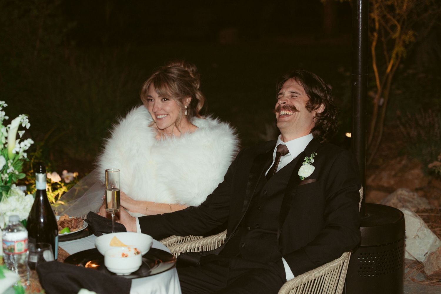 A collection of wedding reception photos showing dancing and celebration in a dimly lit venue.