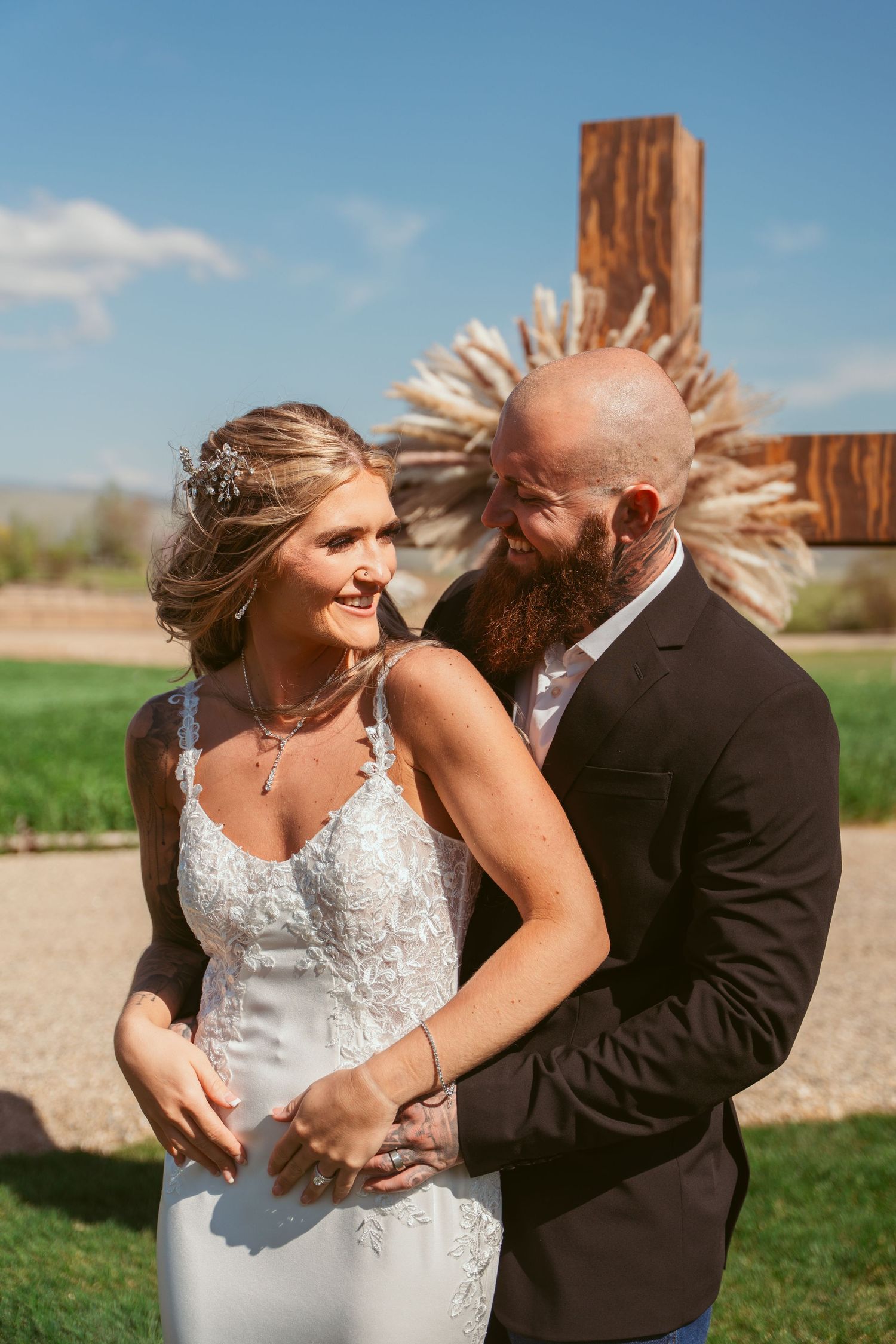 A couple shares a romantic moment in formal wedding attire on their special day.