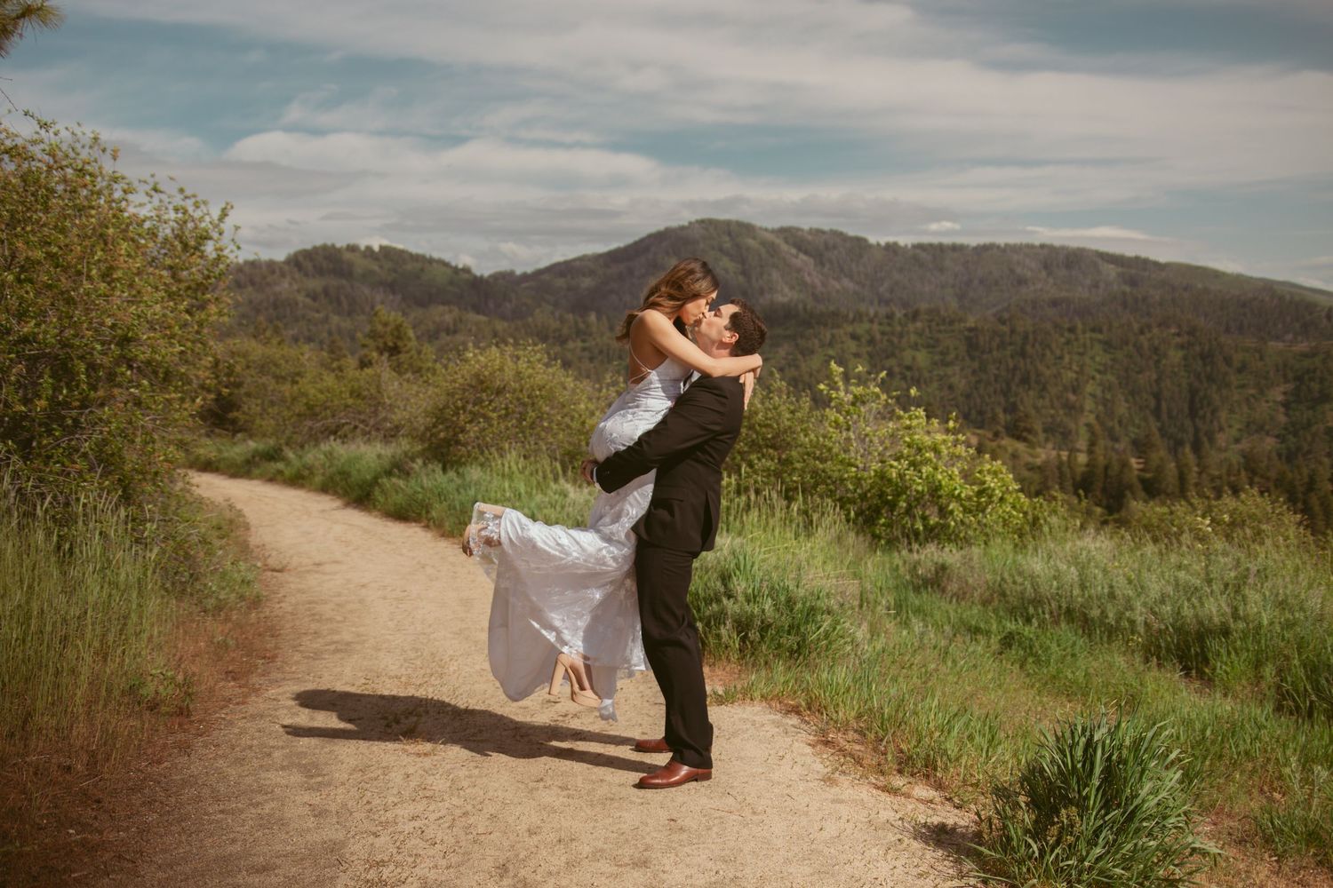Scenic mountain wedding photography with dramatic landscape views.