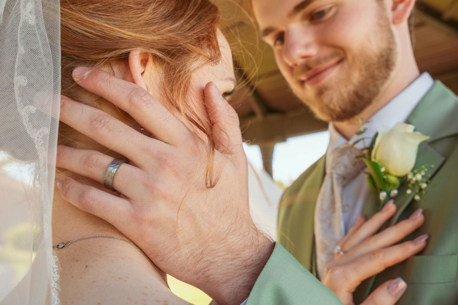 Romantic wedding detail shots showing rings and formal attire.