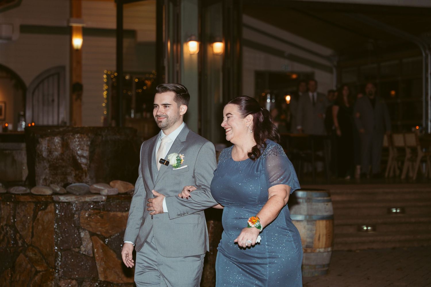 Nighttime gathering at an outdoor venue with ambient lighting.