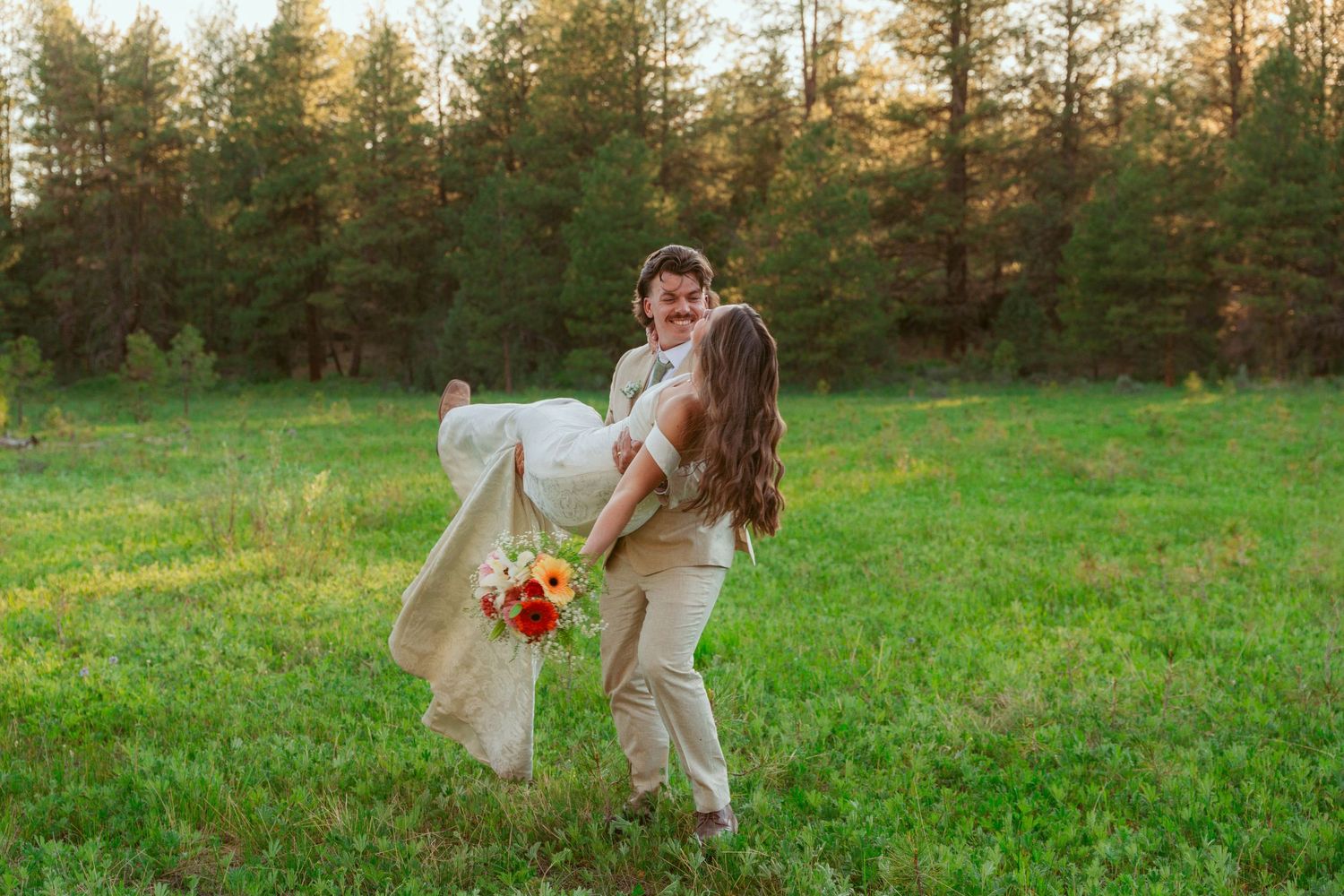 Joyful moments captured in a sunset meadow with forest backdrop.