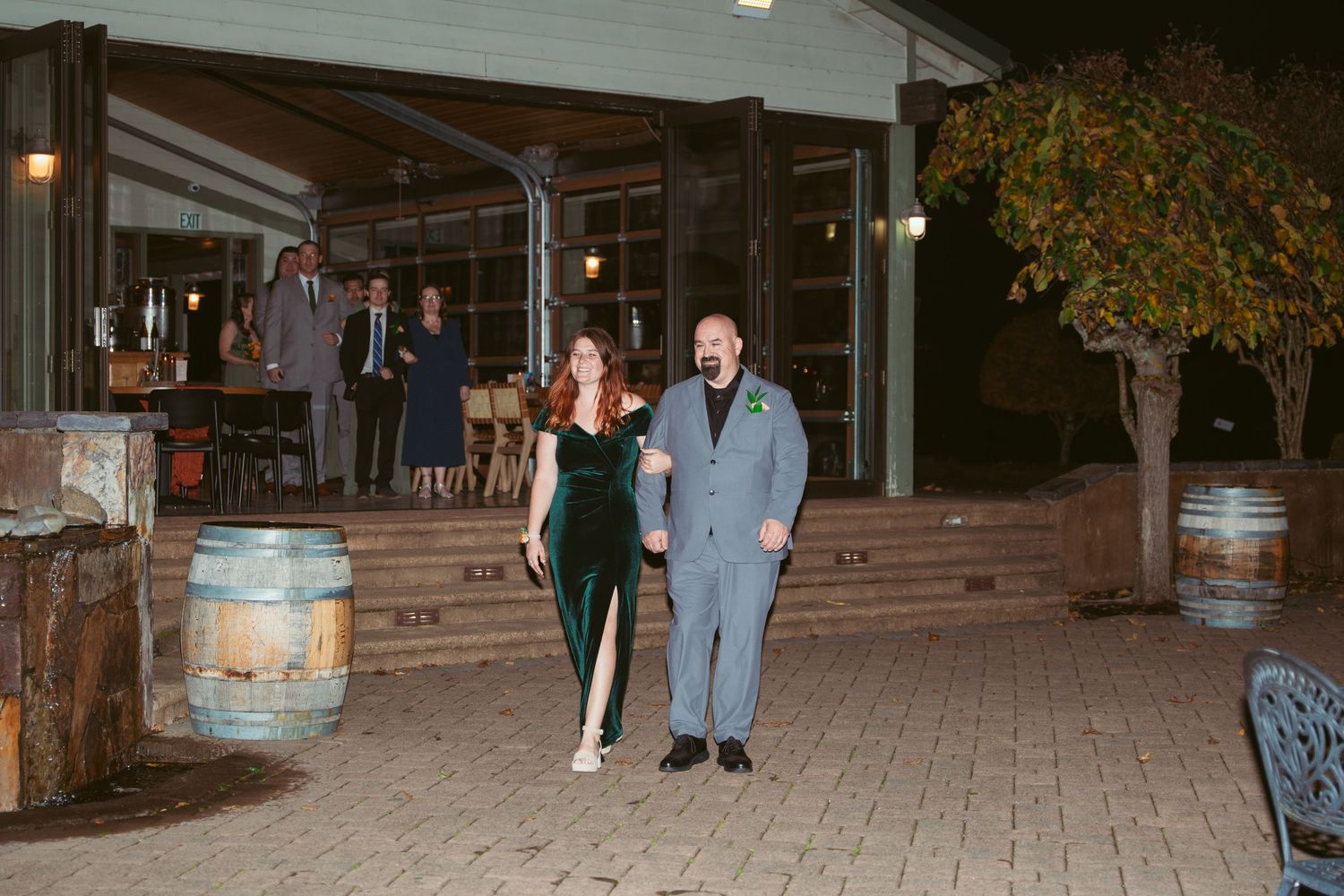 Outdoor patio area of an event venue illuminated at night.