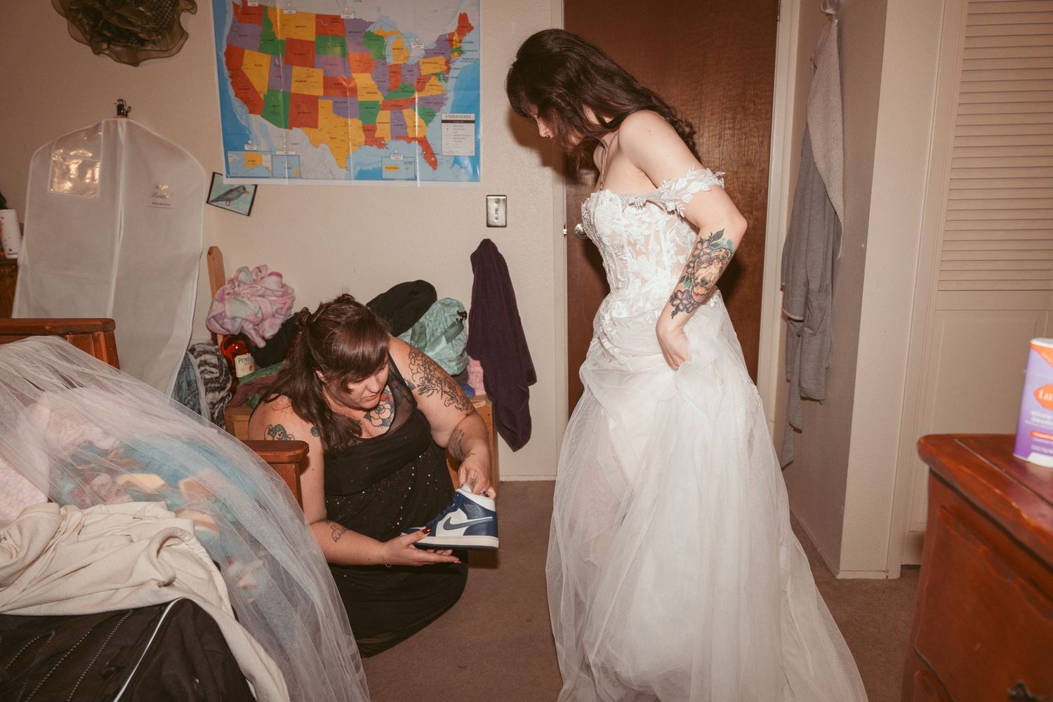Wedding celebration in a room with a US map wall decoration.