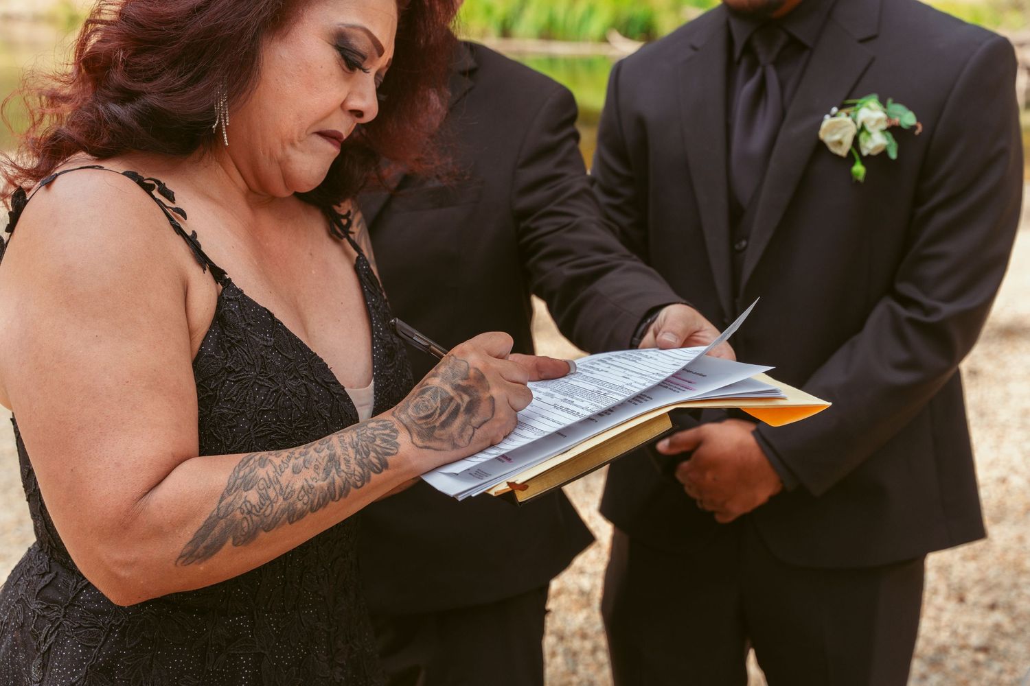 Candid moments shared between wedding couples during an outdoor ceremony.