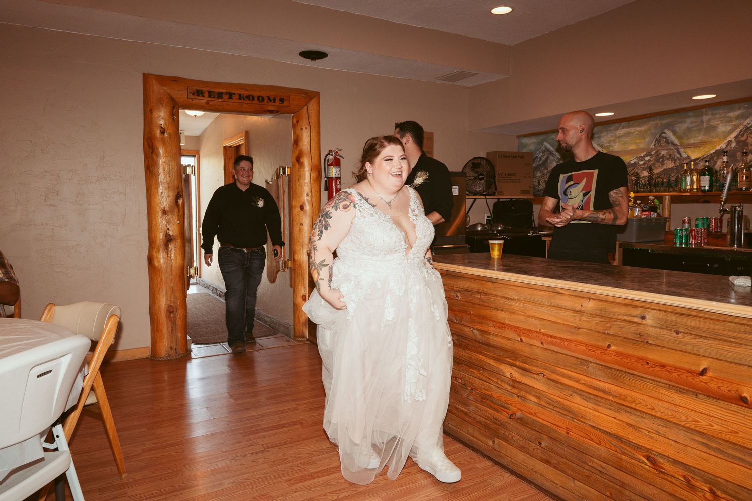 A sequence of photos showing a wedding couple dancing in a rustic wooden reception venue with warm lighting.