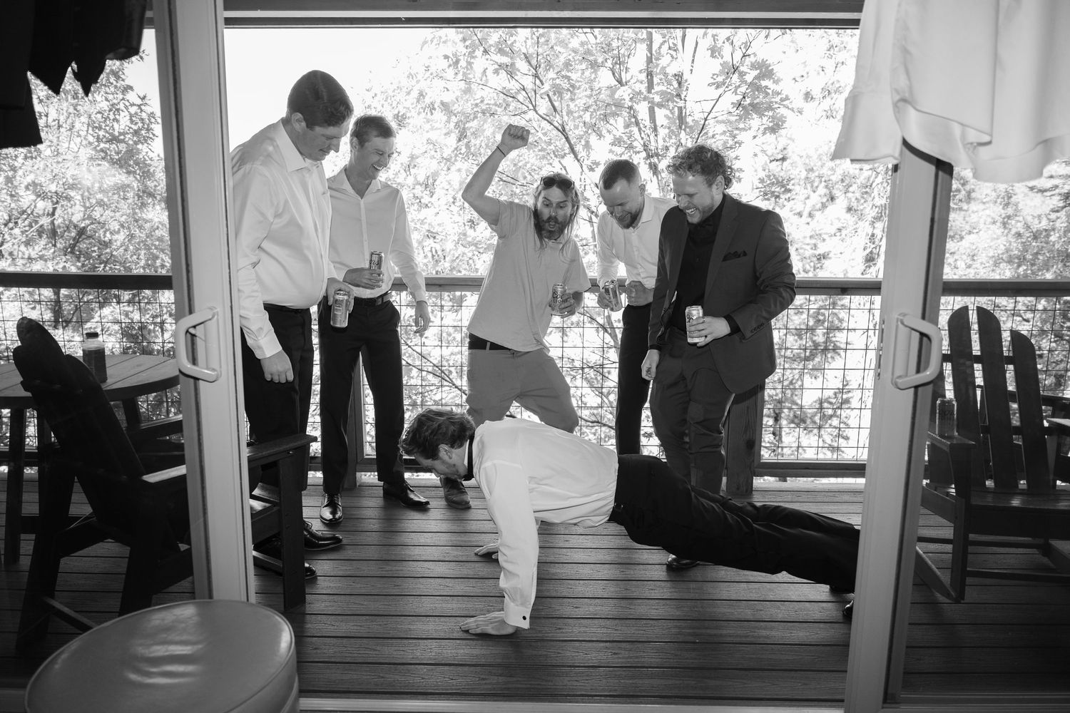 Black and white photo series showing groomsmen getting ready in formal attire on a porch.