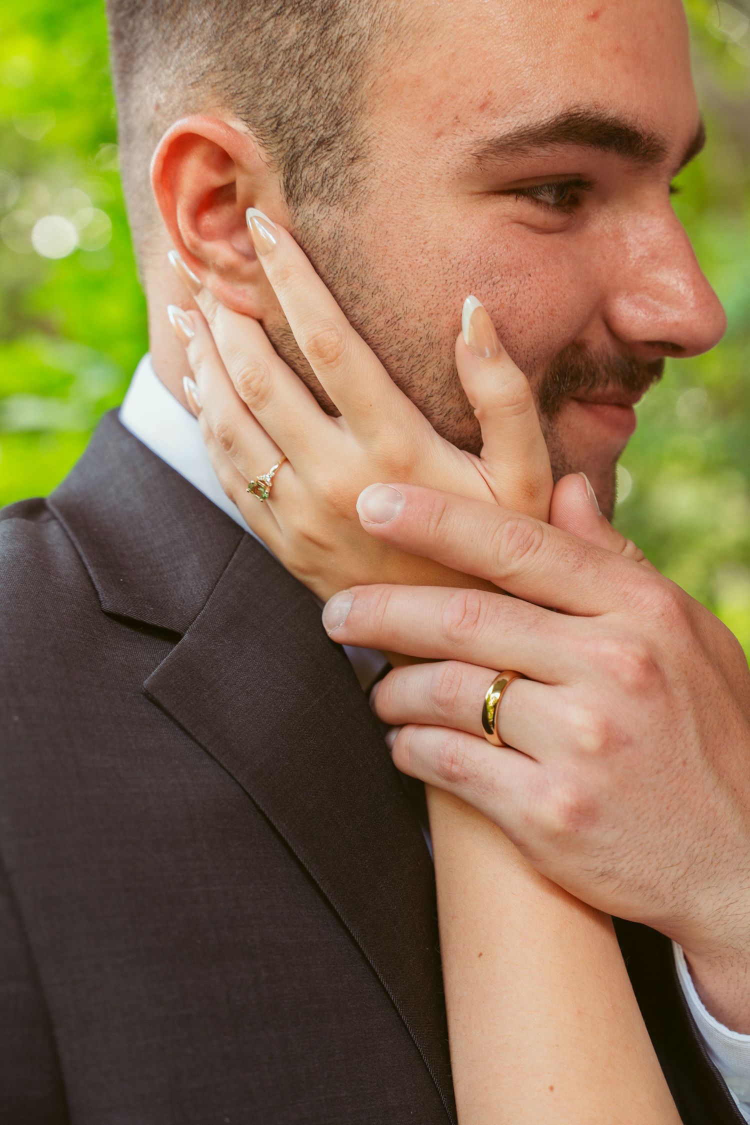 Gentle hands caress during an intimate wedding moment.