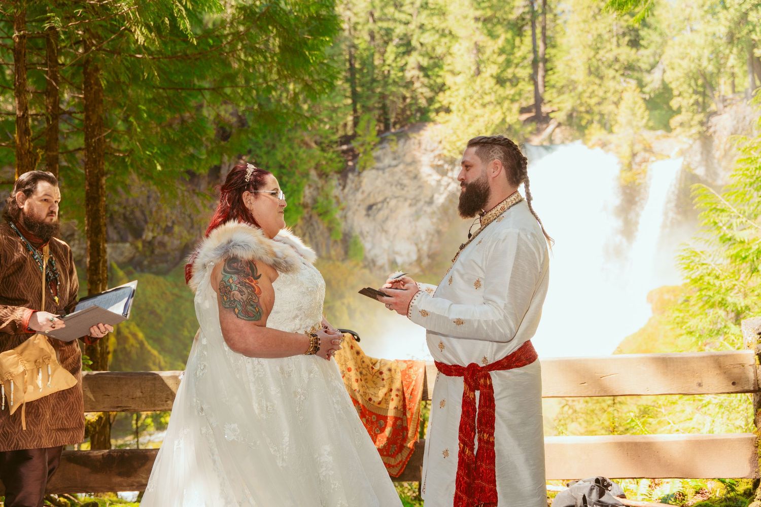 Sun-dappled forest wedding scene with elegant white dress and traditional details.