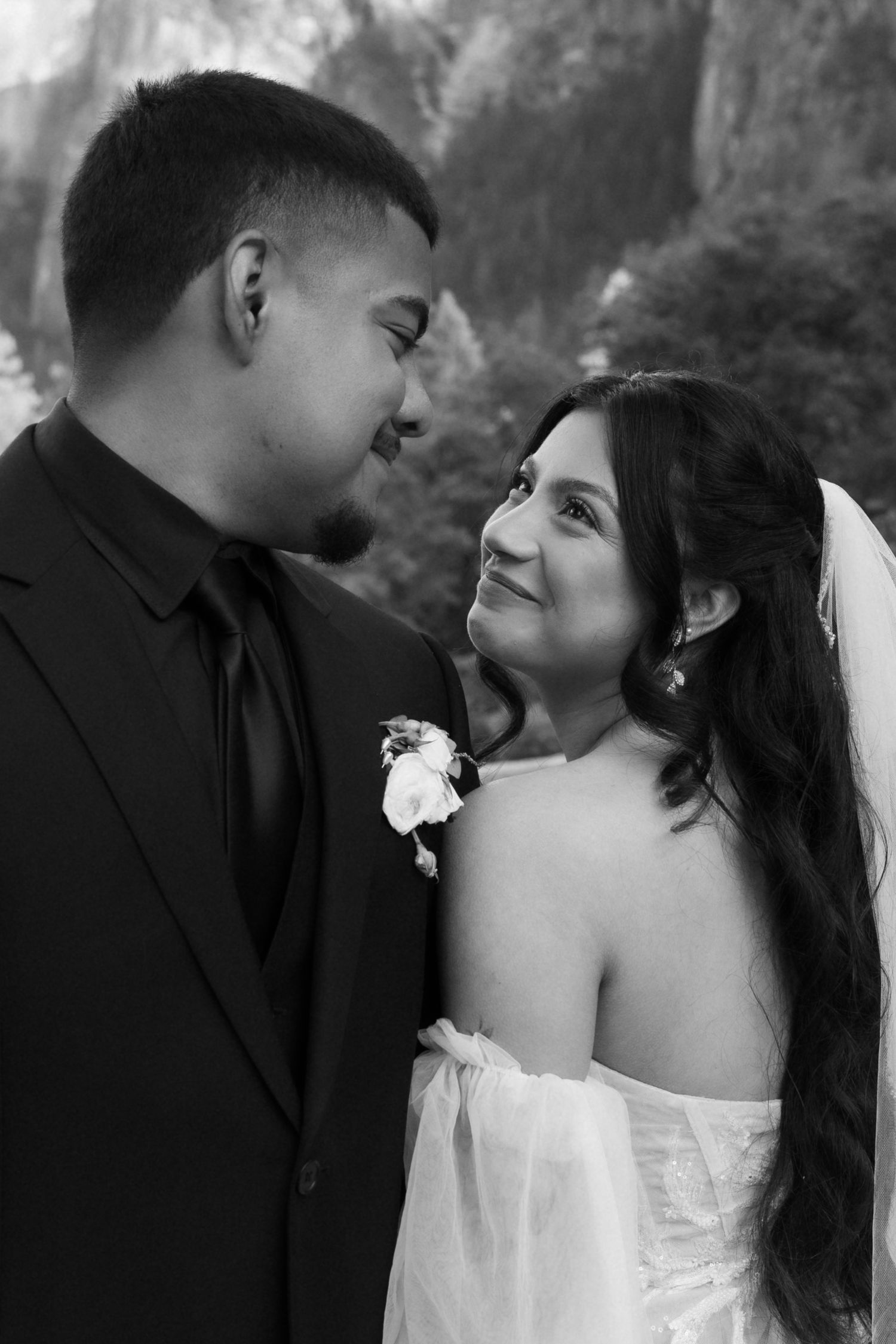 Black and white wedding portraits capturing intimate moments between newlyweds.
