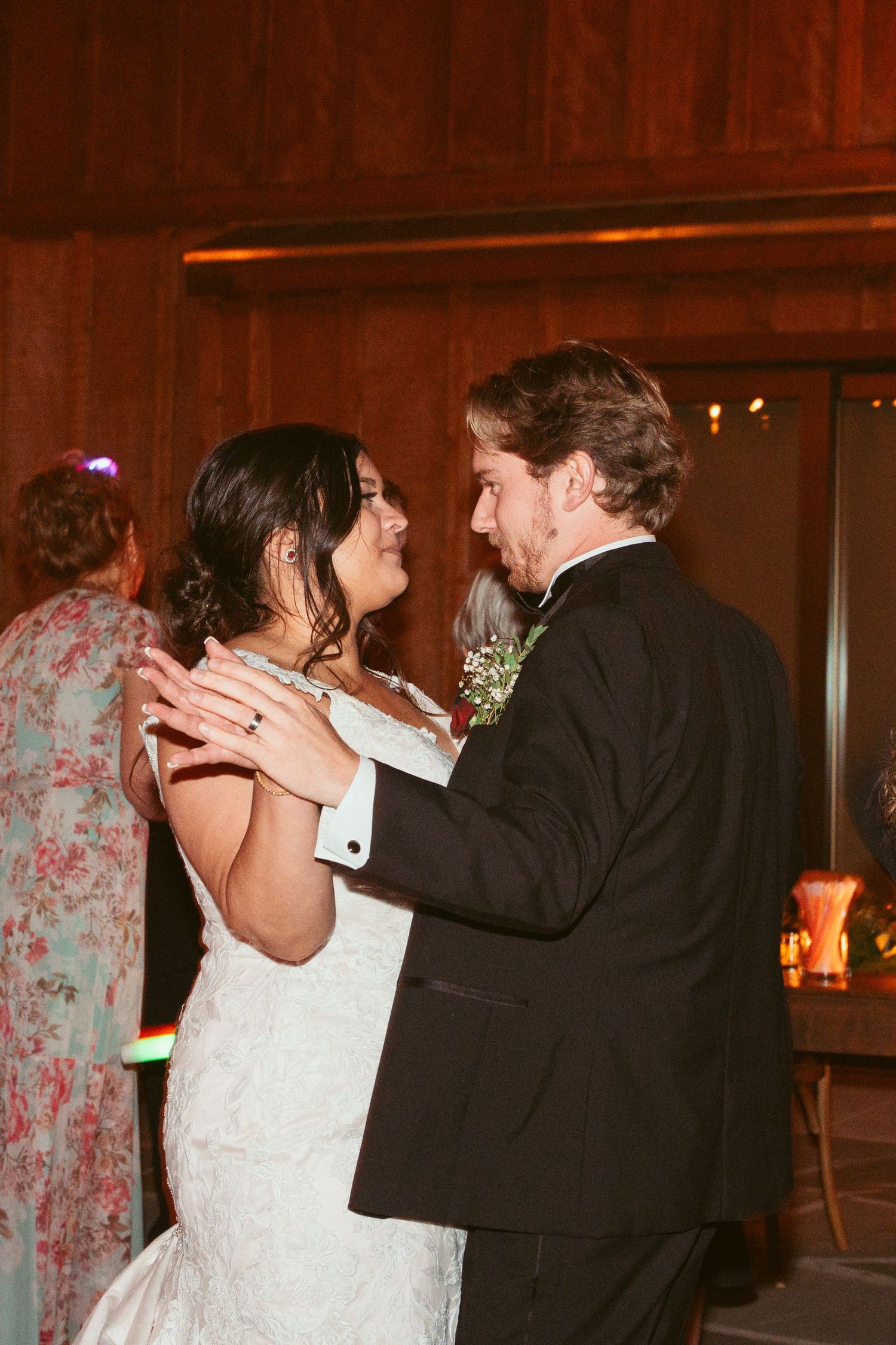 Wedding couple shares a romantic dance moment during their evening reception.