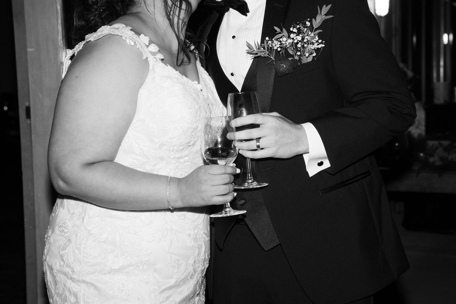 Wedding reception candid moments captured in black and white photography.