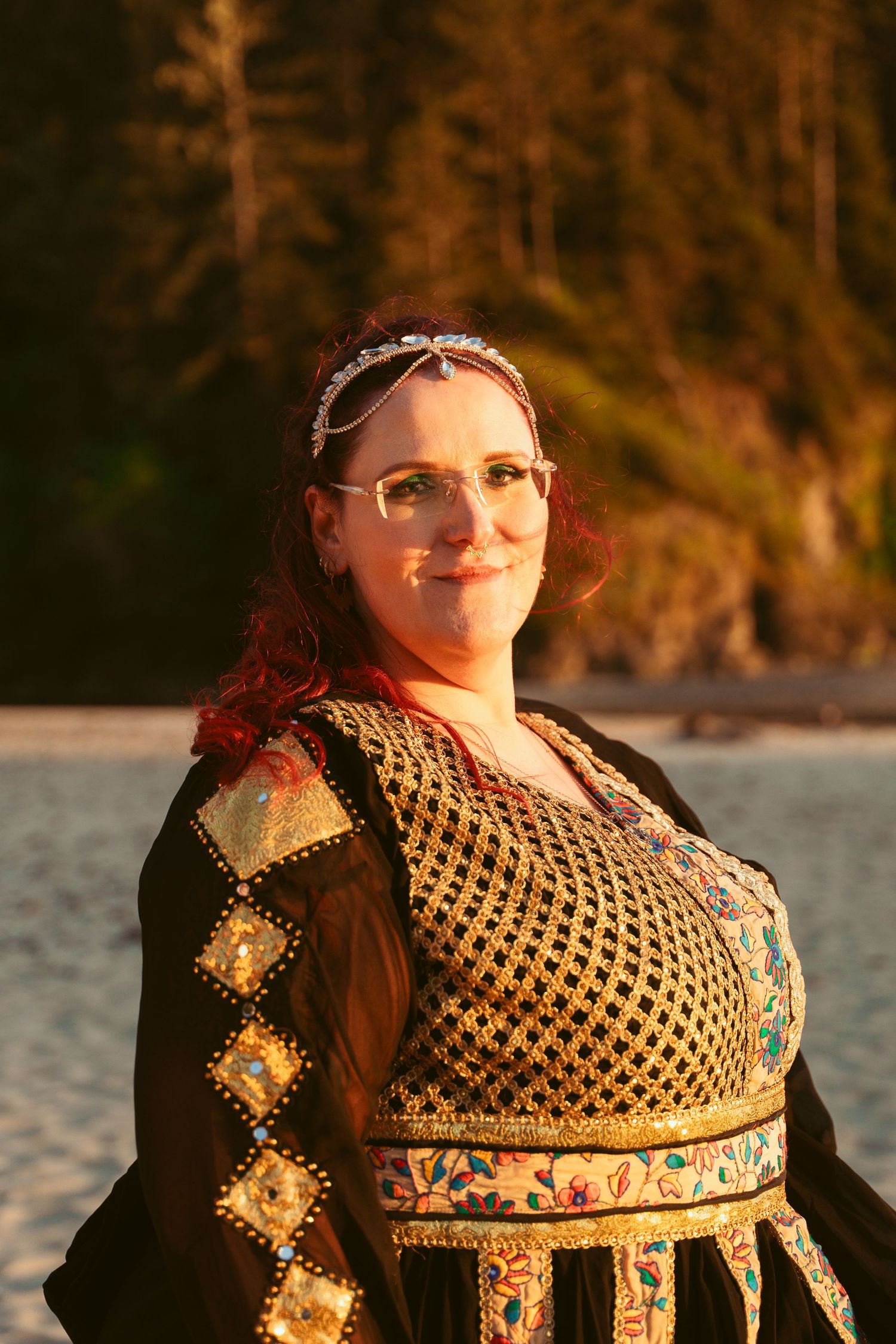 A detailed view of an ornate medieval-style dress with gold embroidery and patterns.