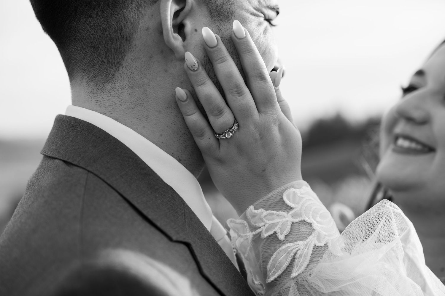 Close-up black and white wedding portrait showing tender emotional moment.