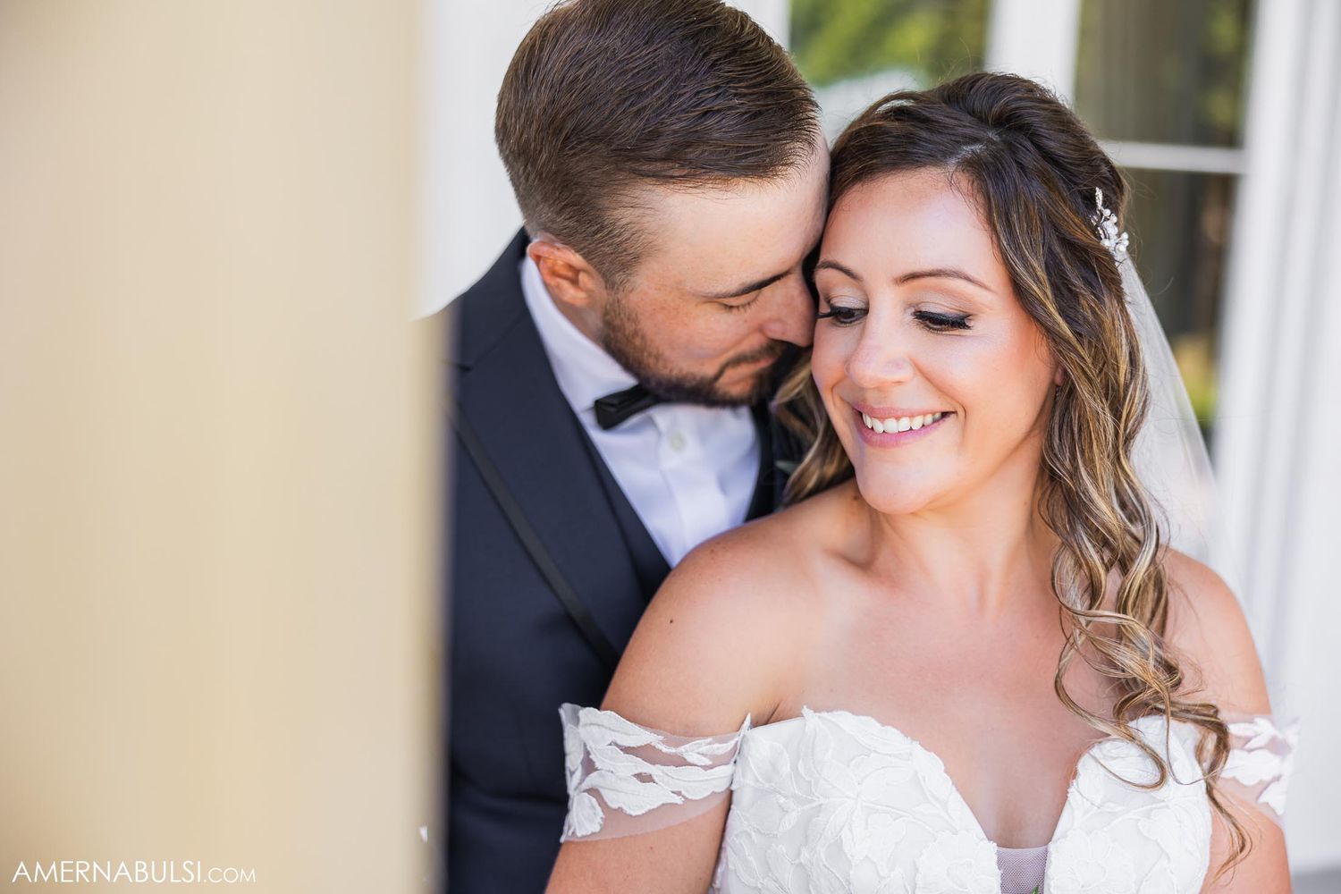 Intimate wedding portrait showing tender moment between newlyweds.