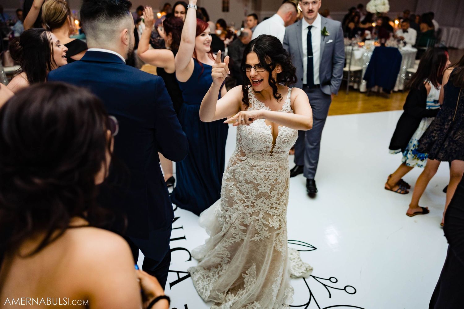 Wedding reception dancers enjoying themselves on a custom-printed dance floor.