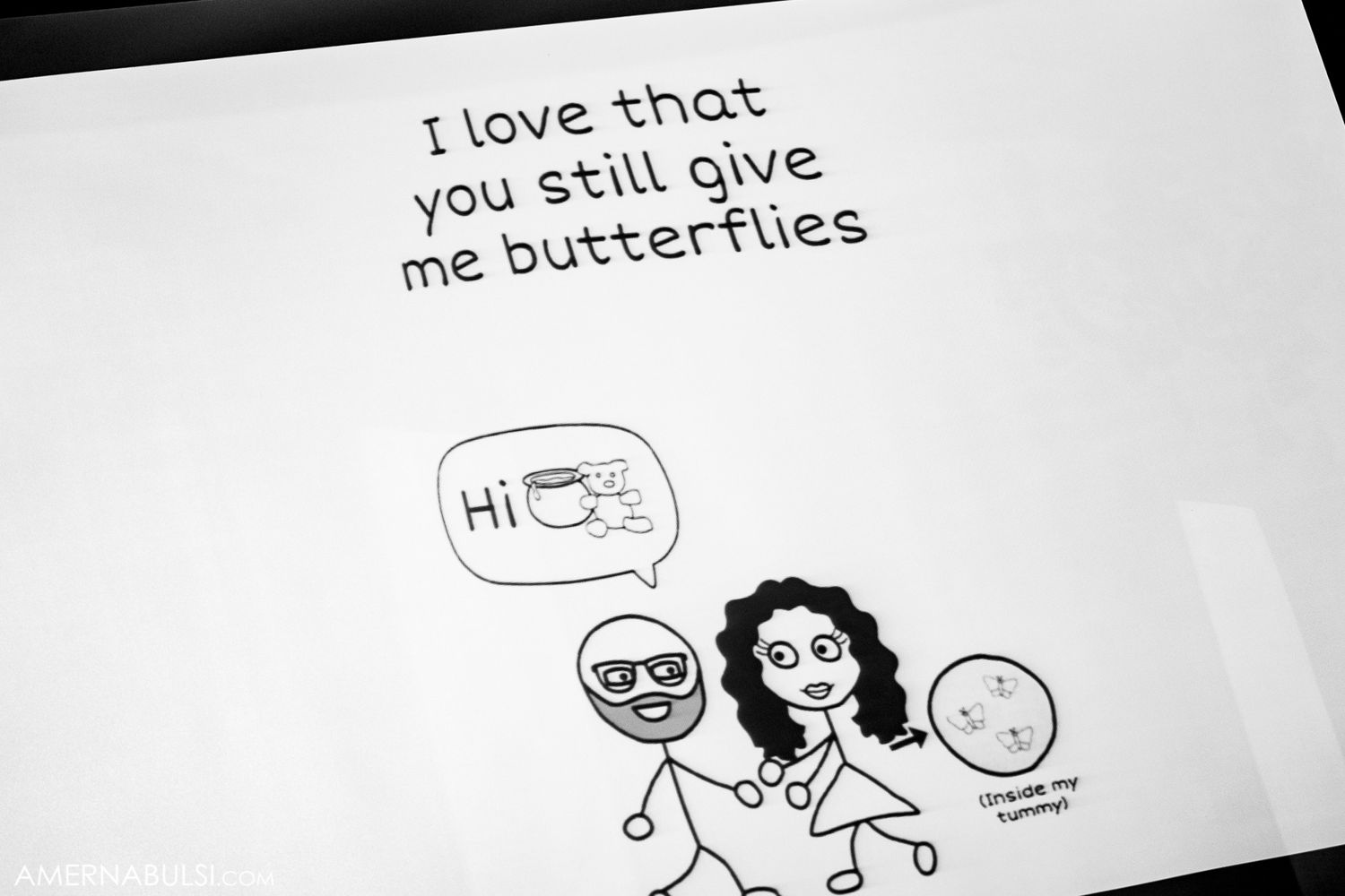Hand-drawn stick figure illustrations and text messages on white paper.