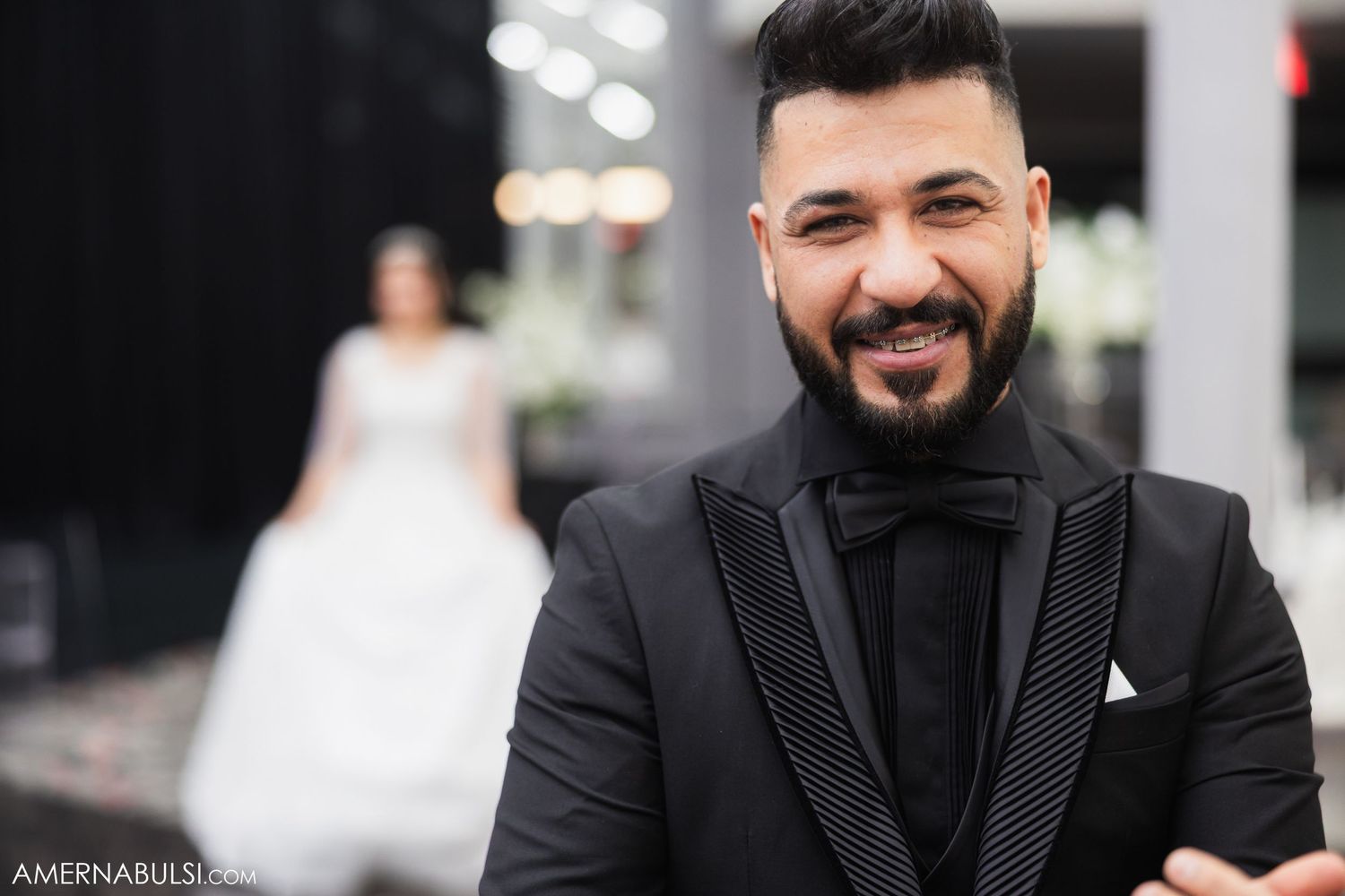 Wedding portraits showing groom in classic black suit with stylish details.