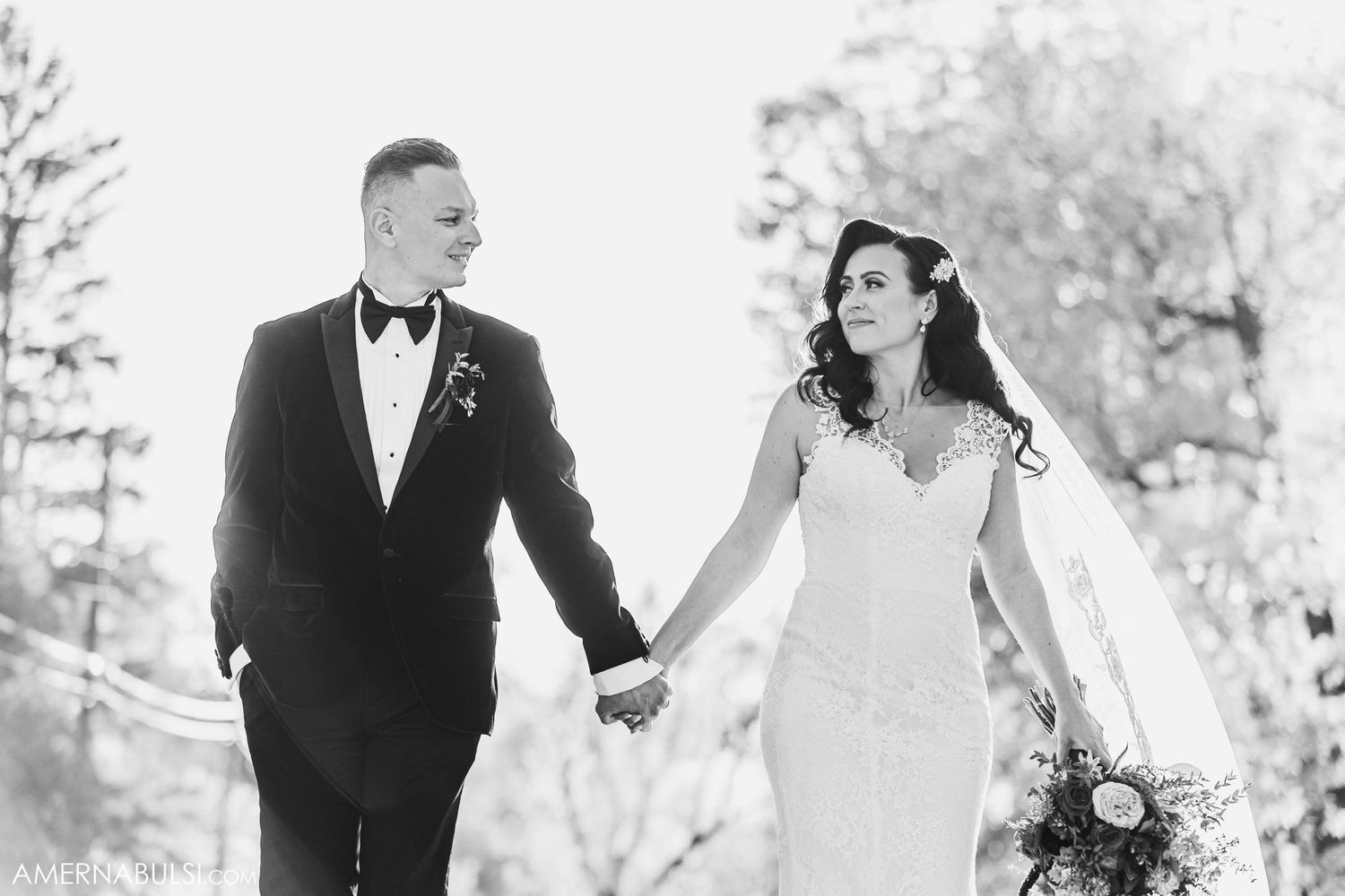 Romantic black and white portrait in natural outdoor setting.