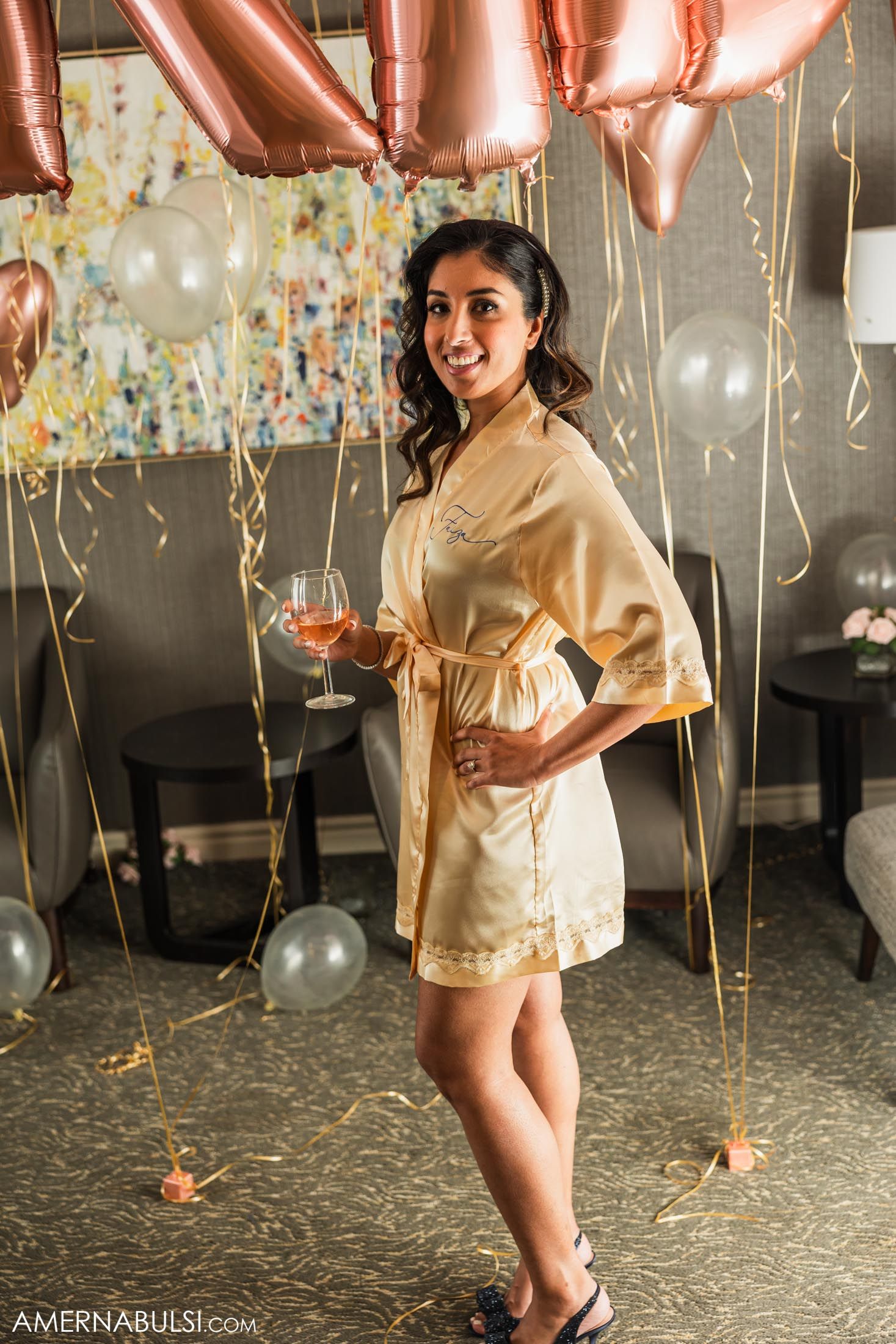 Getting ready scene with gold balloons and confetti decorations at a wedding celebration.