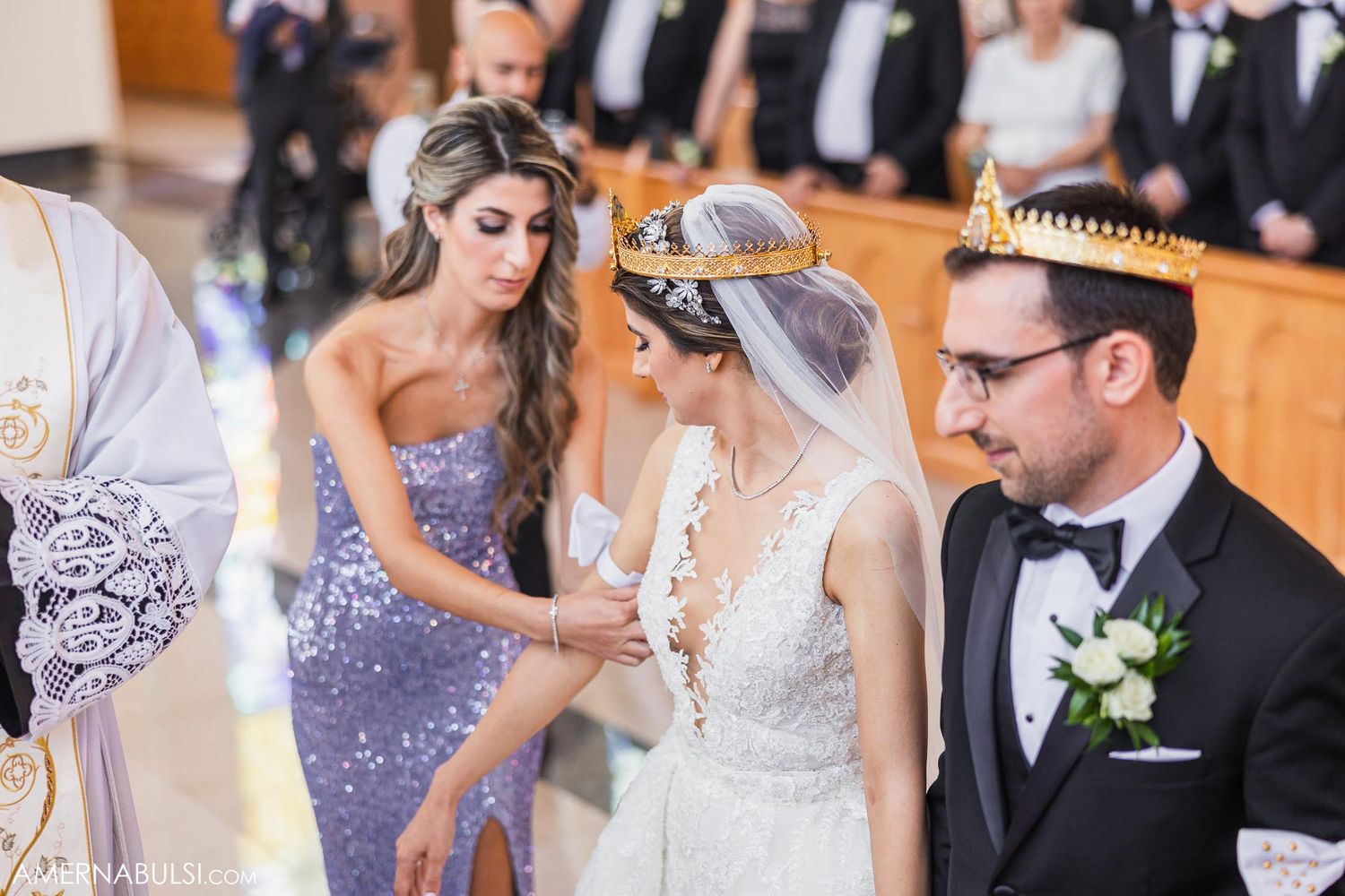 Wedding celebration with attendees in formal attire during church ceremony.