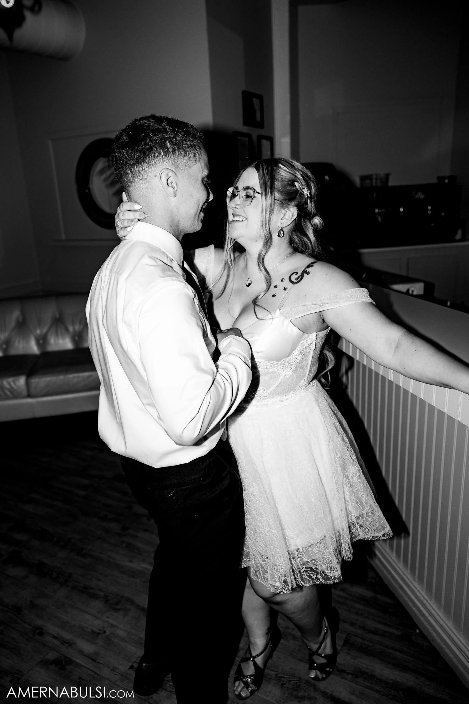 Dance sequence captures romantic spins and twirls between couple in black and white photography.
