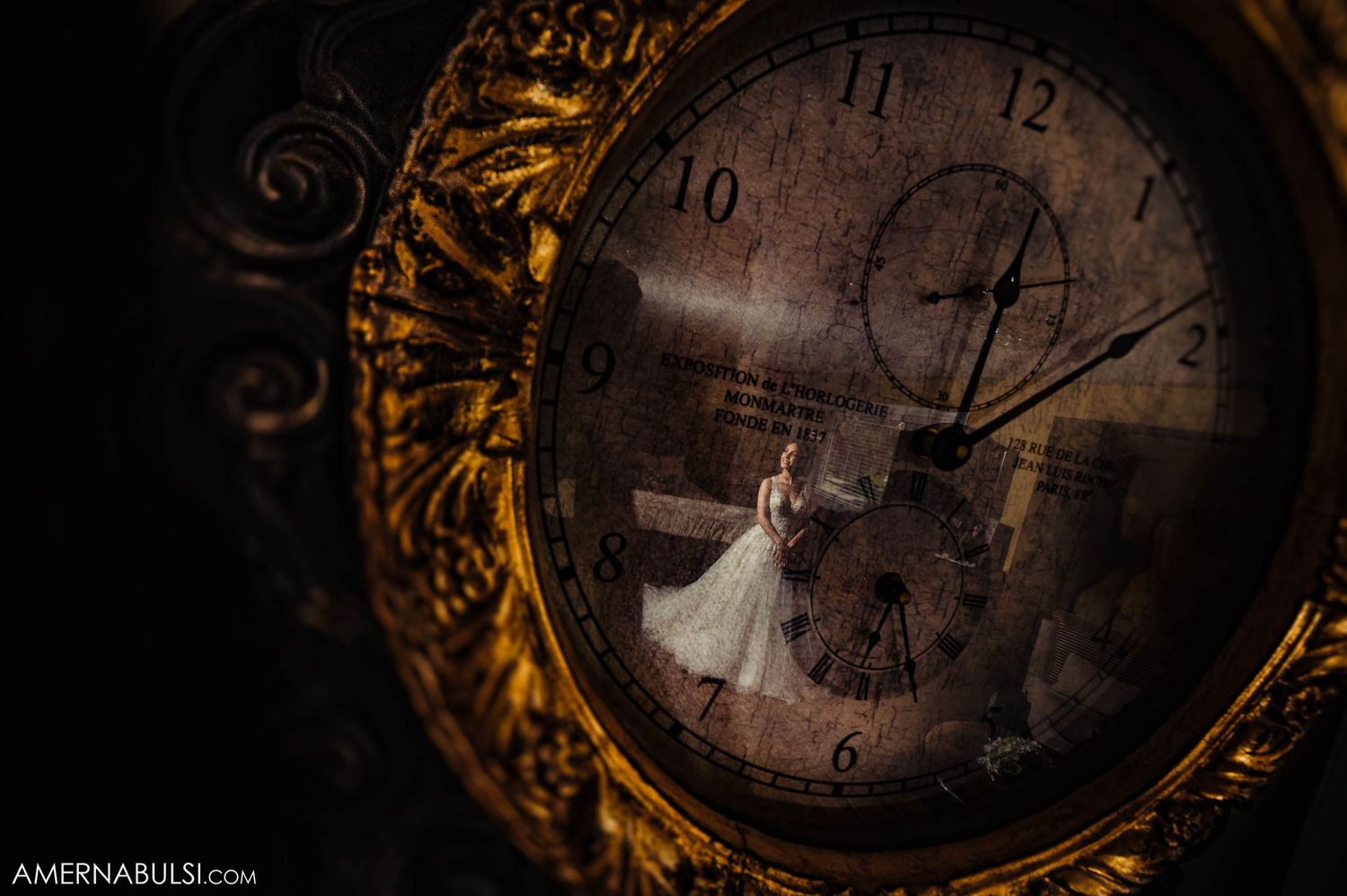 Creative reflection of a bride in a vintage clock face with ornate golden frame.