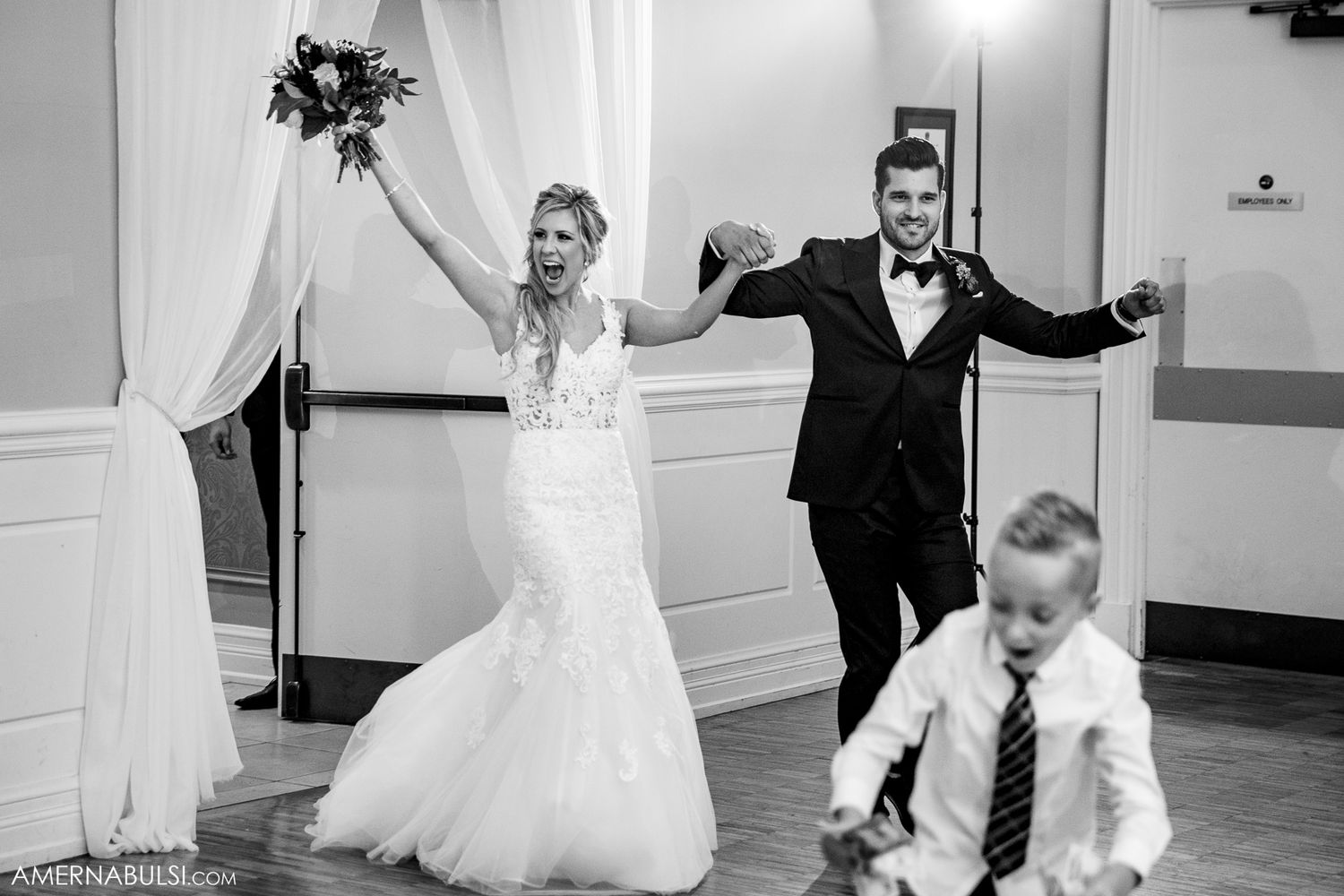 Black and white photos of newlyweds dancing in sequence across elegant ballroom floor.