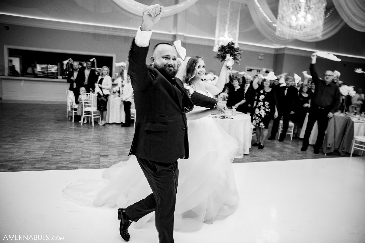 Wedding reception dance floor sequence showing a couple performing elegant dance moves in formal attire.
