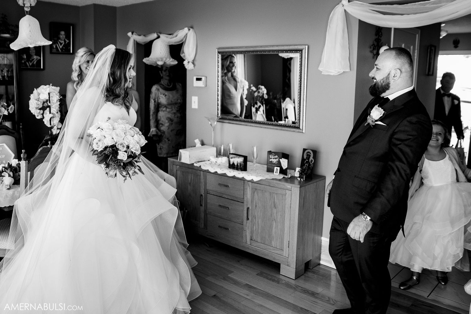Black and white series of candid wedding moments in an indoor reception venue.