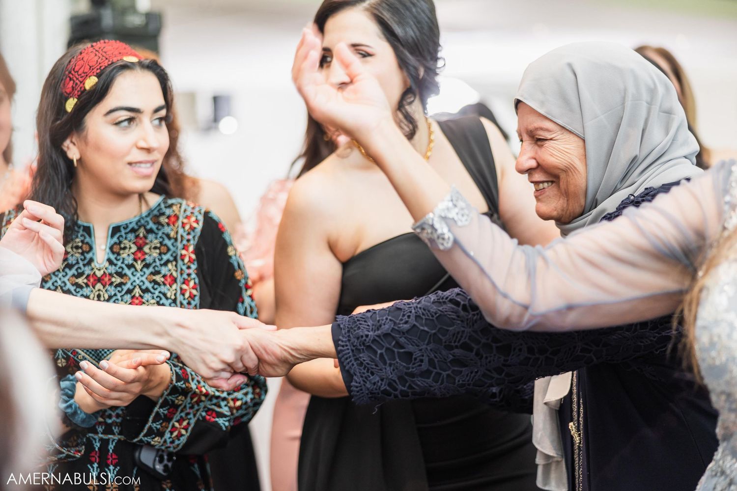 Wedding guests laughing and enjoying themselves during the celebration.