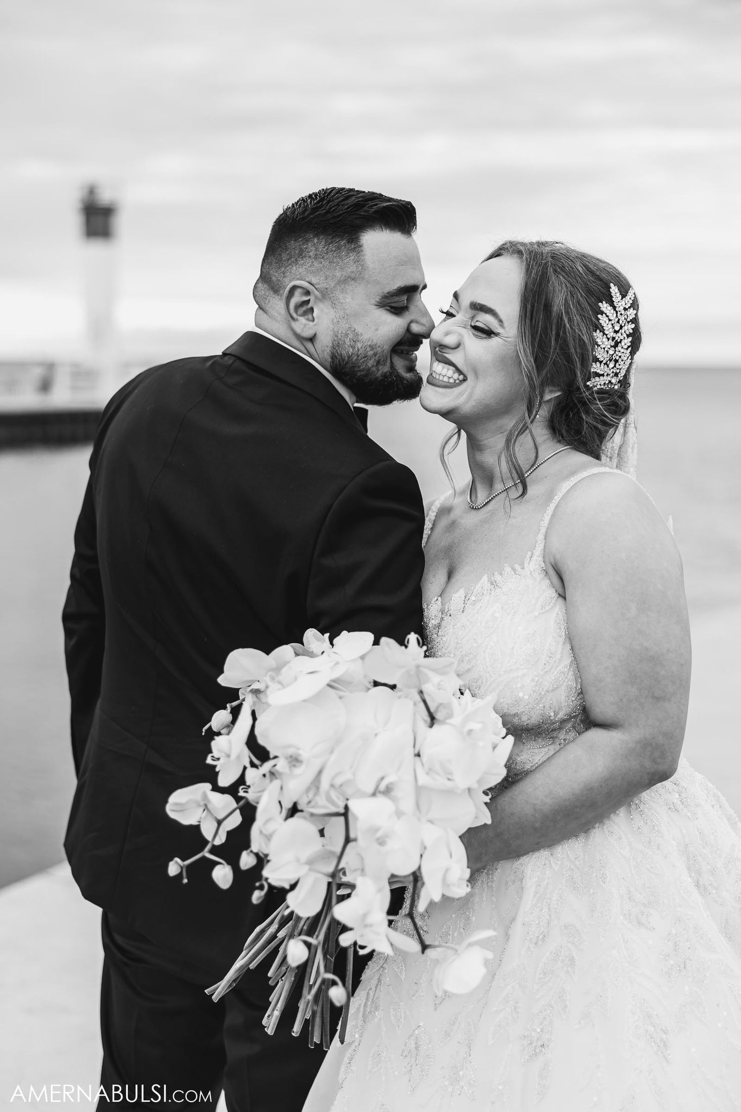 Intimate black and white wedding portrait with white orchid bouquet.