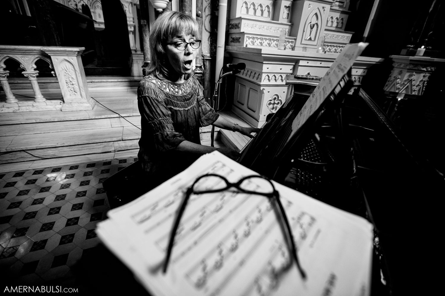 Elegant black and white wedding photography showing details of a church ceremony and preparations.