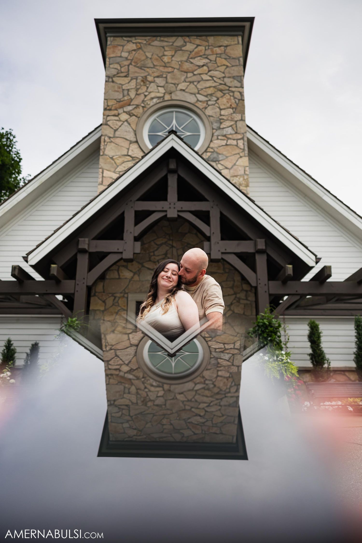Creative mirror reflection of chapel architecture with stone and wood details.