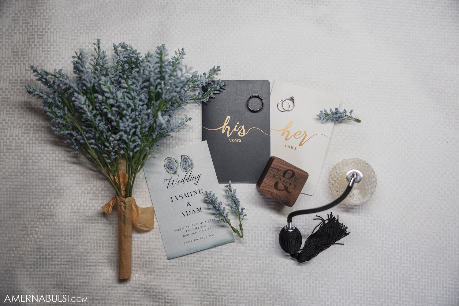 Wedding invitation suite with lavender sprigs and wax seals on white background.