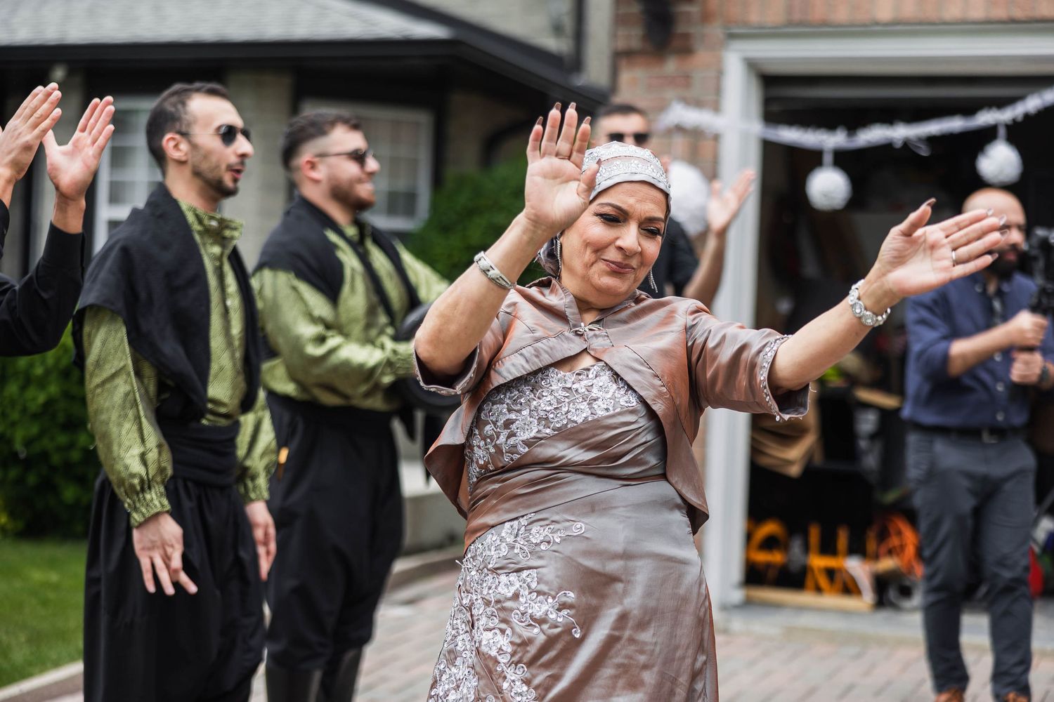 Wedding guest dancing joyfully at outdoor reception celebration.