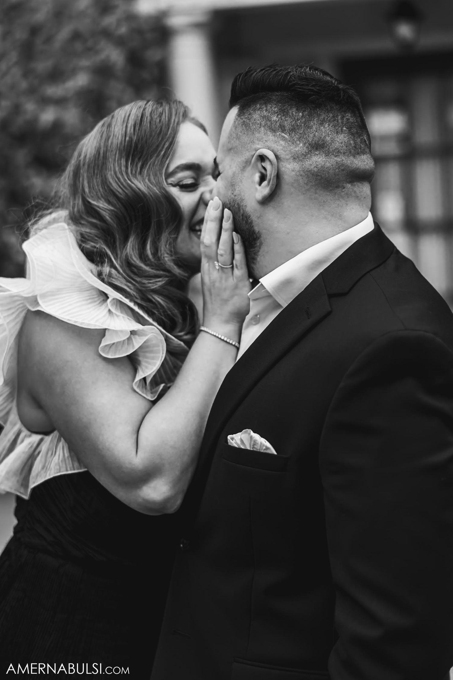 A romantic couple shares an intimate moment during their engagement photoshoot.