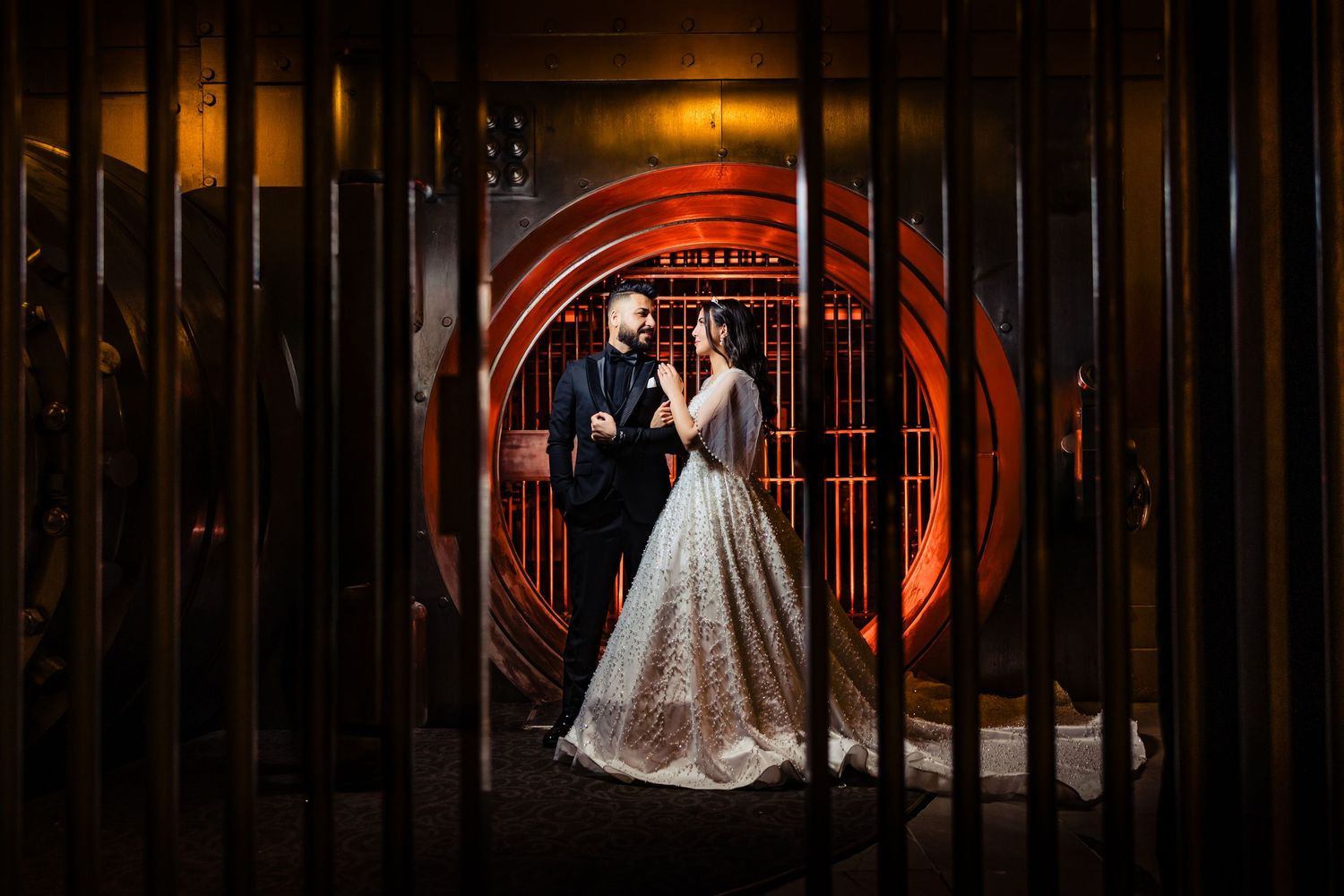 Artistic wedding portraits framed through decorative iron gate patterns.