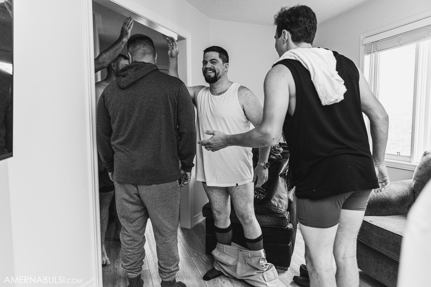 Casual gathering of people chatting in casual attire.