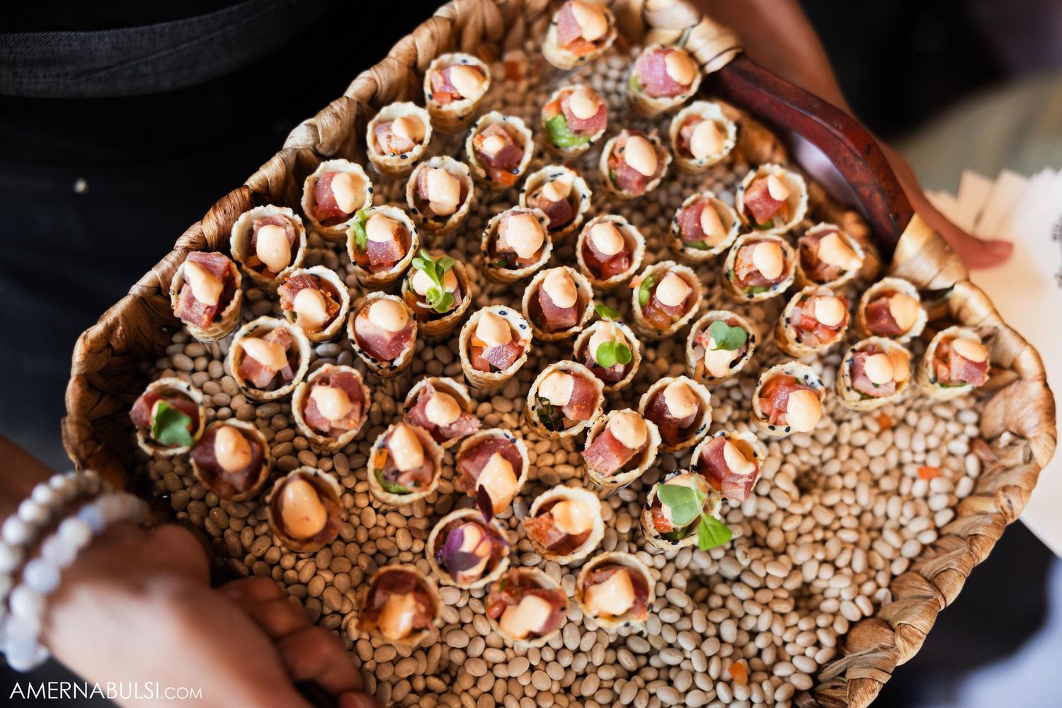 Close-up of rose gold dessert display arranged in geometric pattern.