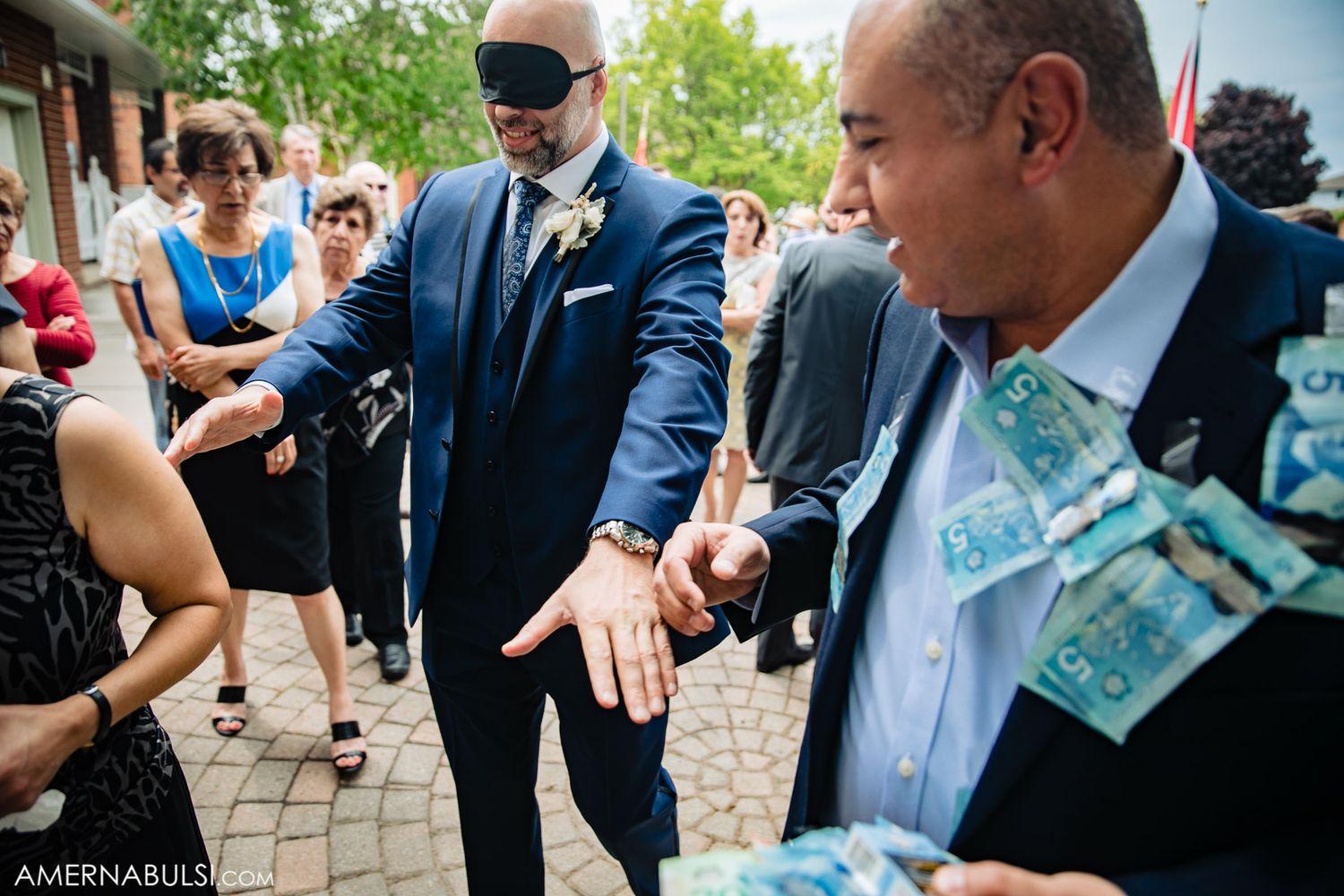 Wedding guests sharing laughter and joy during outdoor celebration.