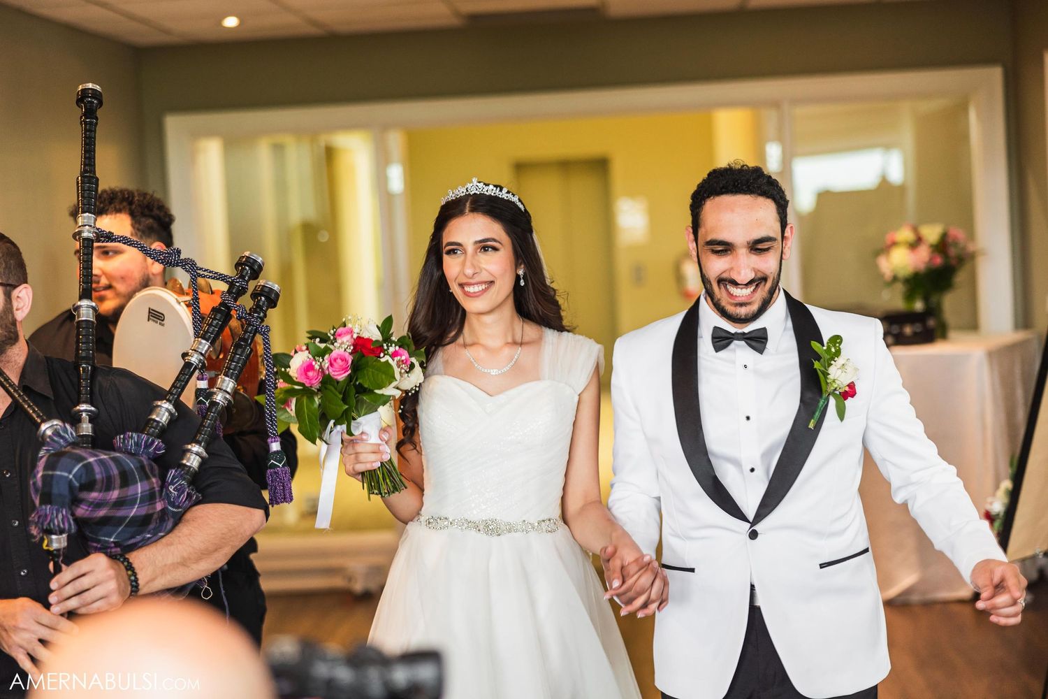 The newlyweds make their grand entrance into the reception hall.