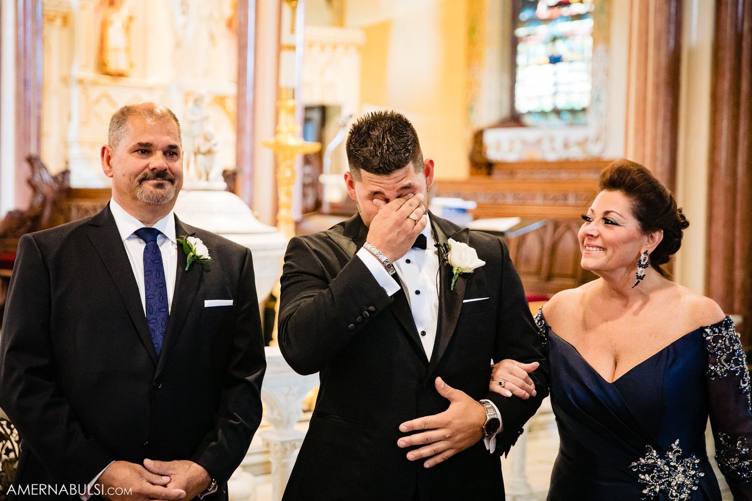 Wedding party members in formal attire gather for candid moments during the celebration.