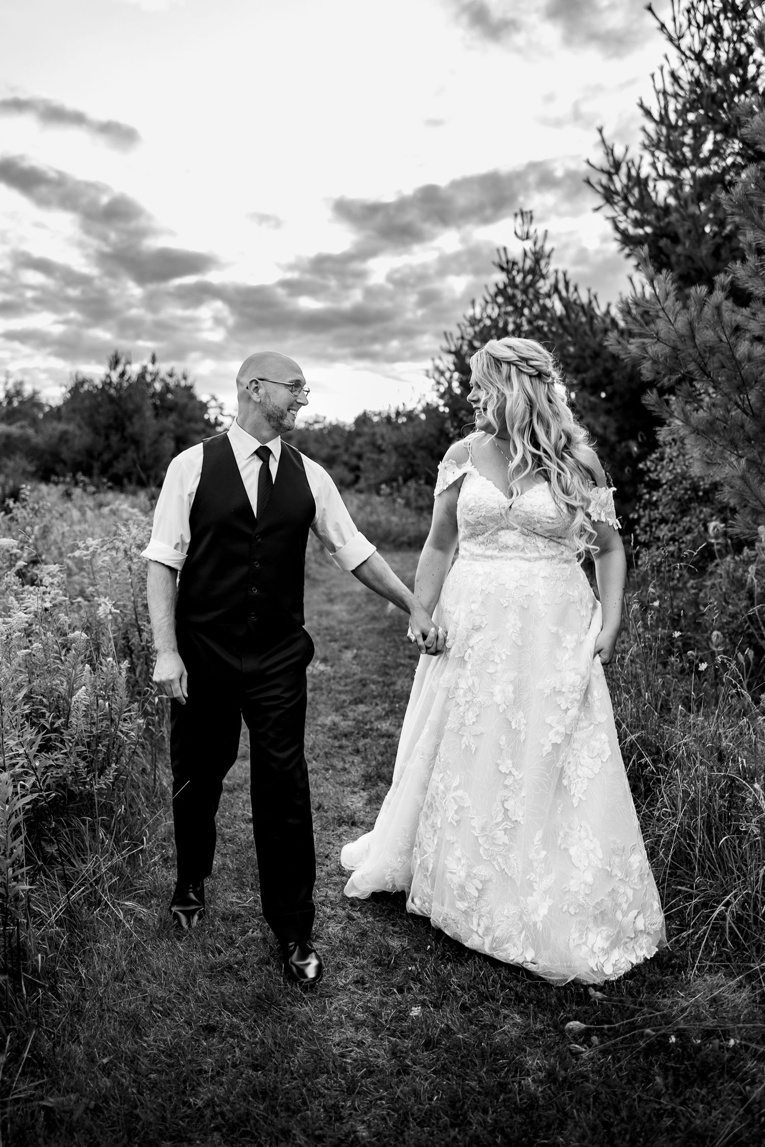 Black and white photo sequence showing a couple sharing intimate moments in an outdoor natural setting at sunset.