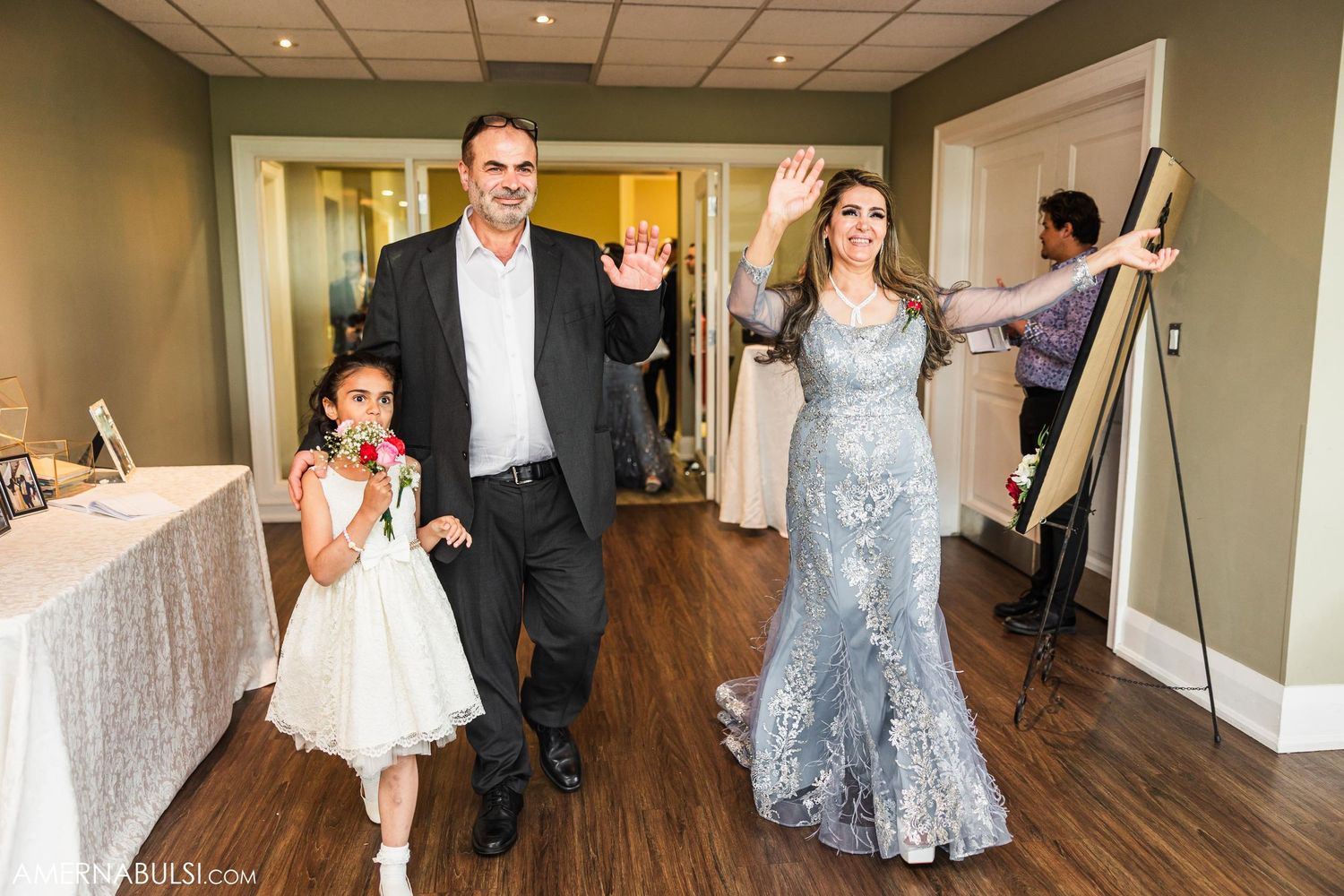 Wedding attendees making a celebratory entrance at the reception.