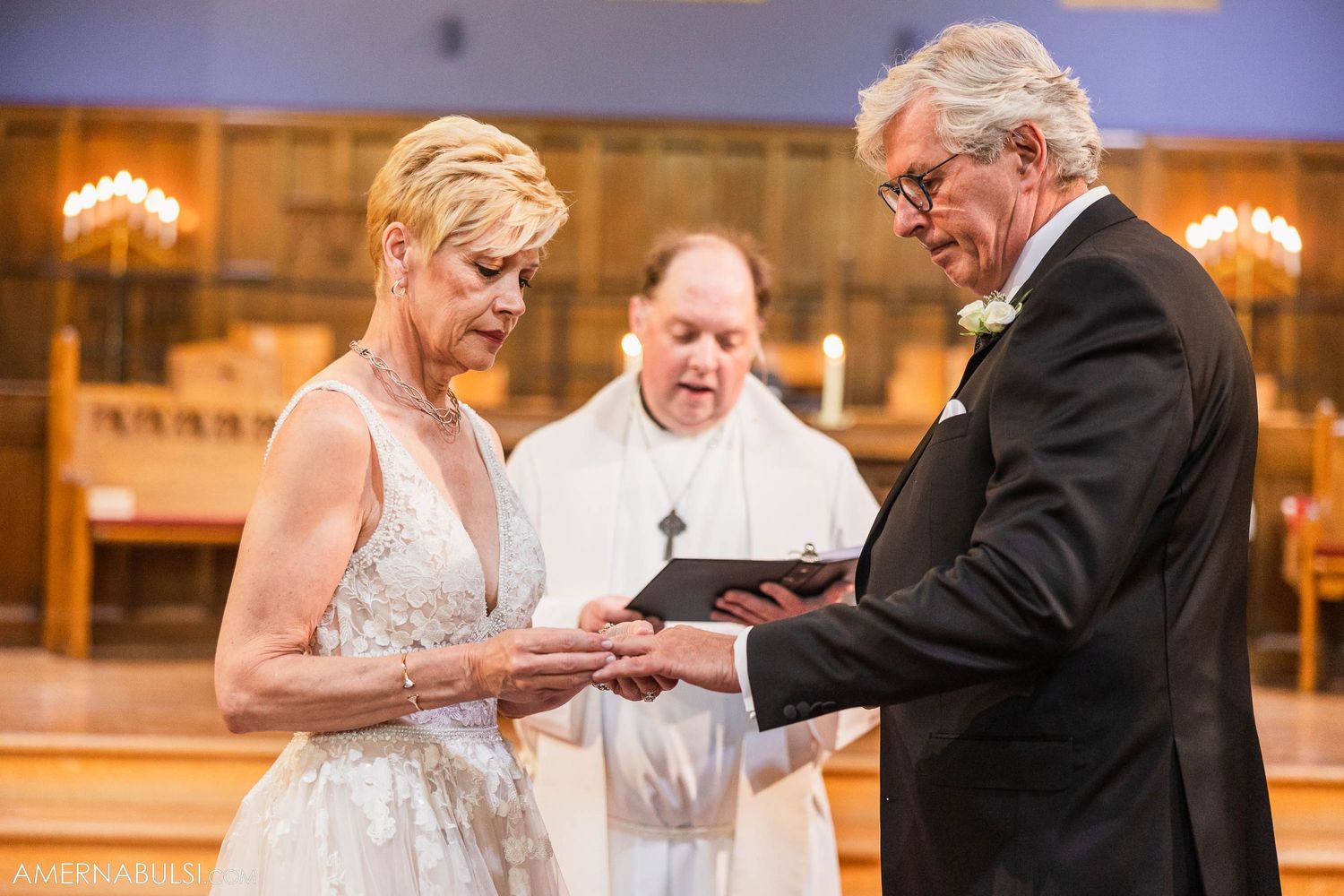 Exchange of rings during traditional church wedding ceremony.