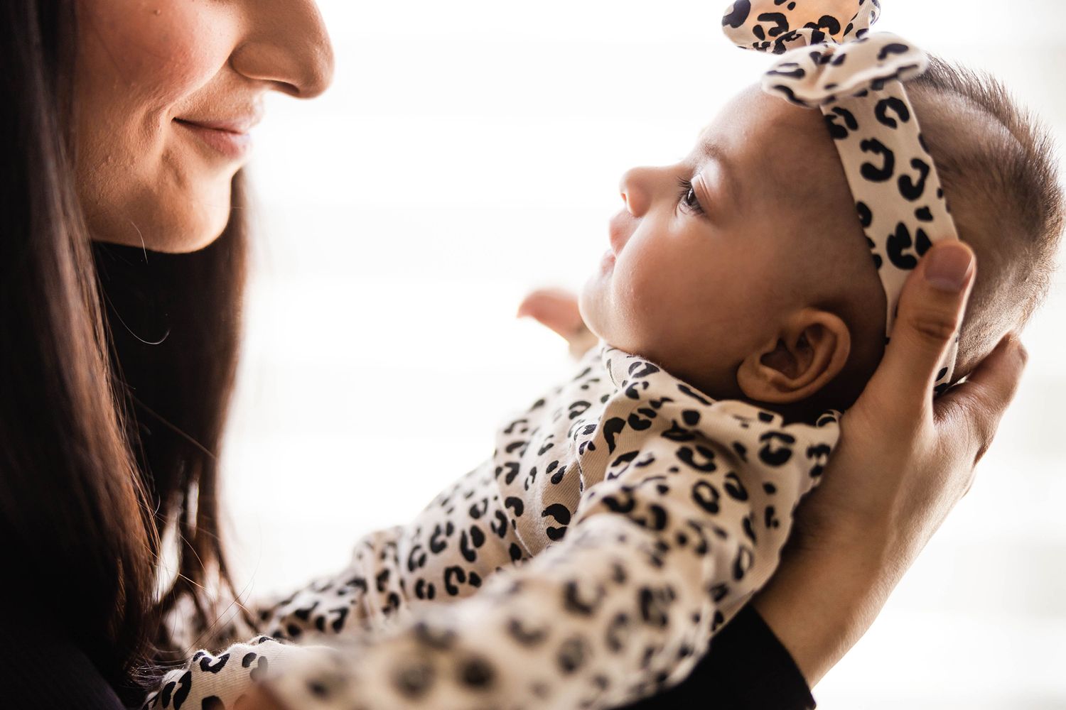 Close up series of someone in an animal print outfit shown from different angles.
